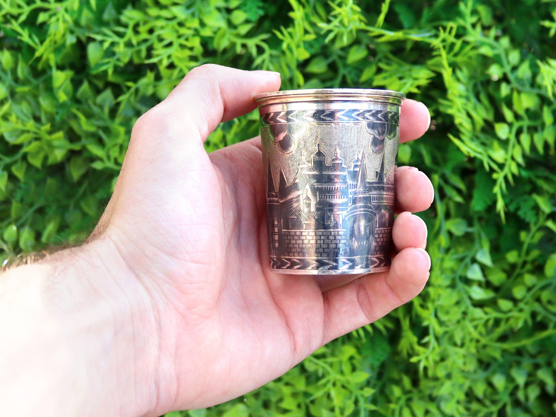 An exceptional, fine and impressive Russian silver gilt and niello enamel beaker, an addition to our Russian silverware collection.

This exceptional antique Russian silver gilt beaker has a cylindrical, tapering form.

The surface of this