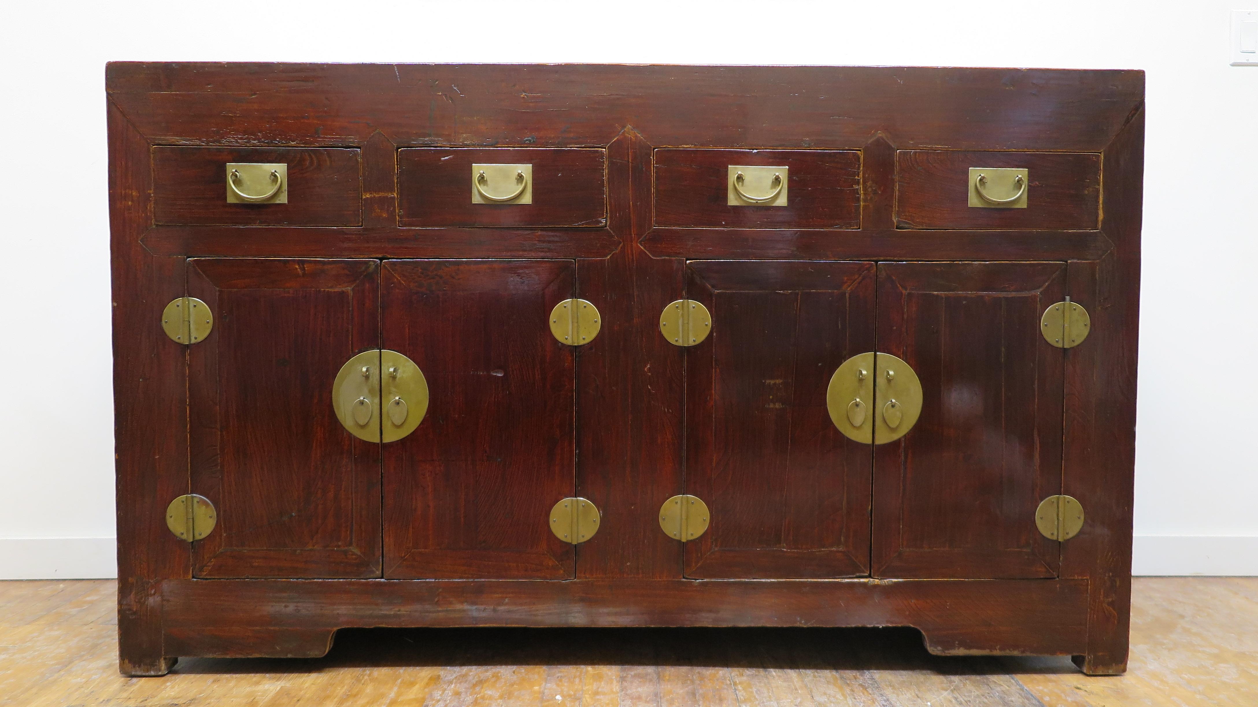 Chinese 19th century Rustic sideboard. Timeless design clean lines and lots of usable storage. Elmwood sideboard having plum lacquer, four upper drawers with two lower cabinets. Strong and solid this sideboard offers functional and practical use
