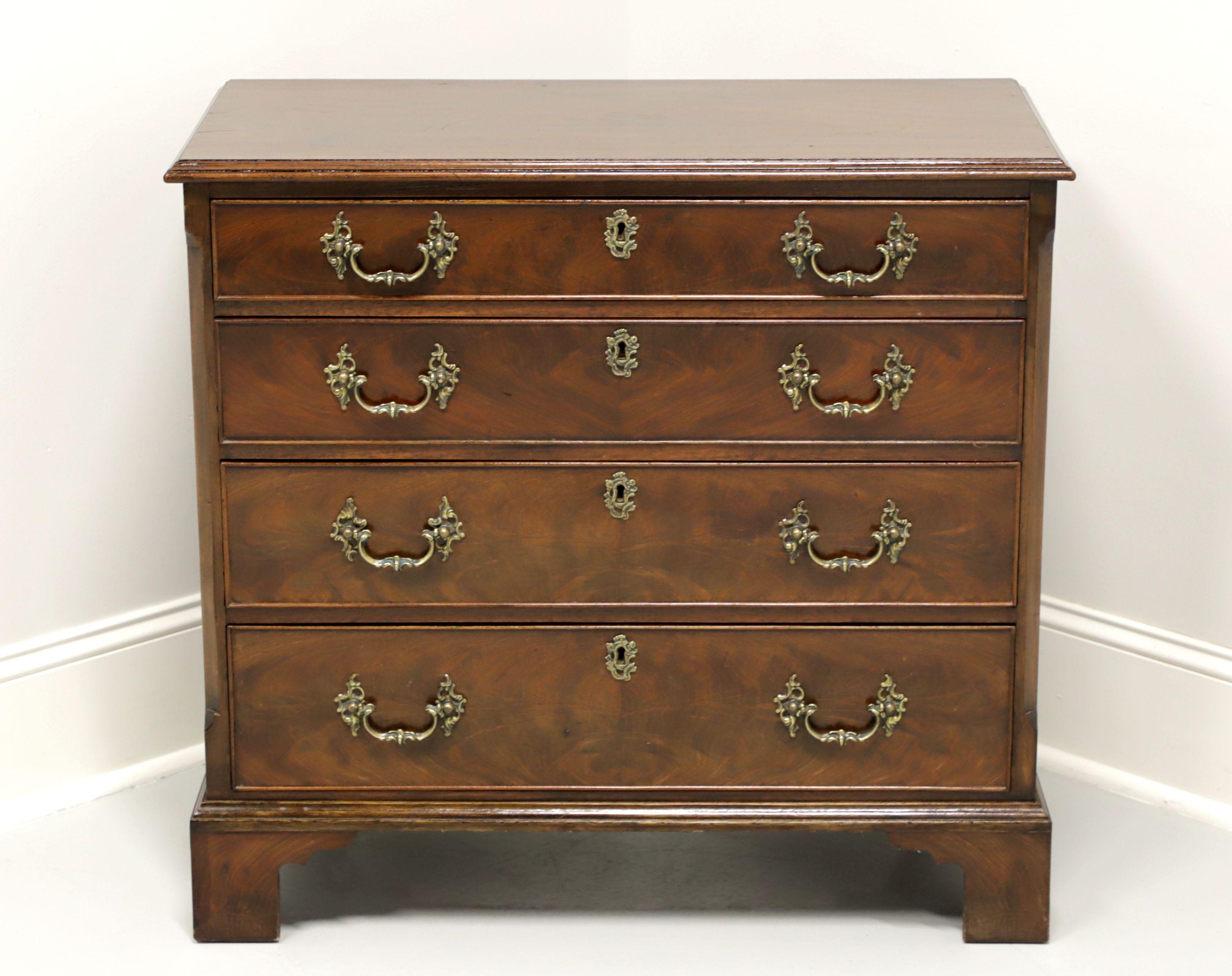 An antique 19th Century Georgian style bachelor chest, unbranded. Walnut with brass hardware and bracket feet. Features four drawers of hand dovetailed construction with locks. Made in the 19th Century in Scotland.

Measures: 32.75w 16.75d