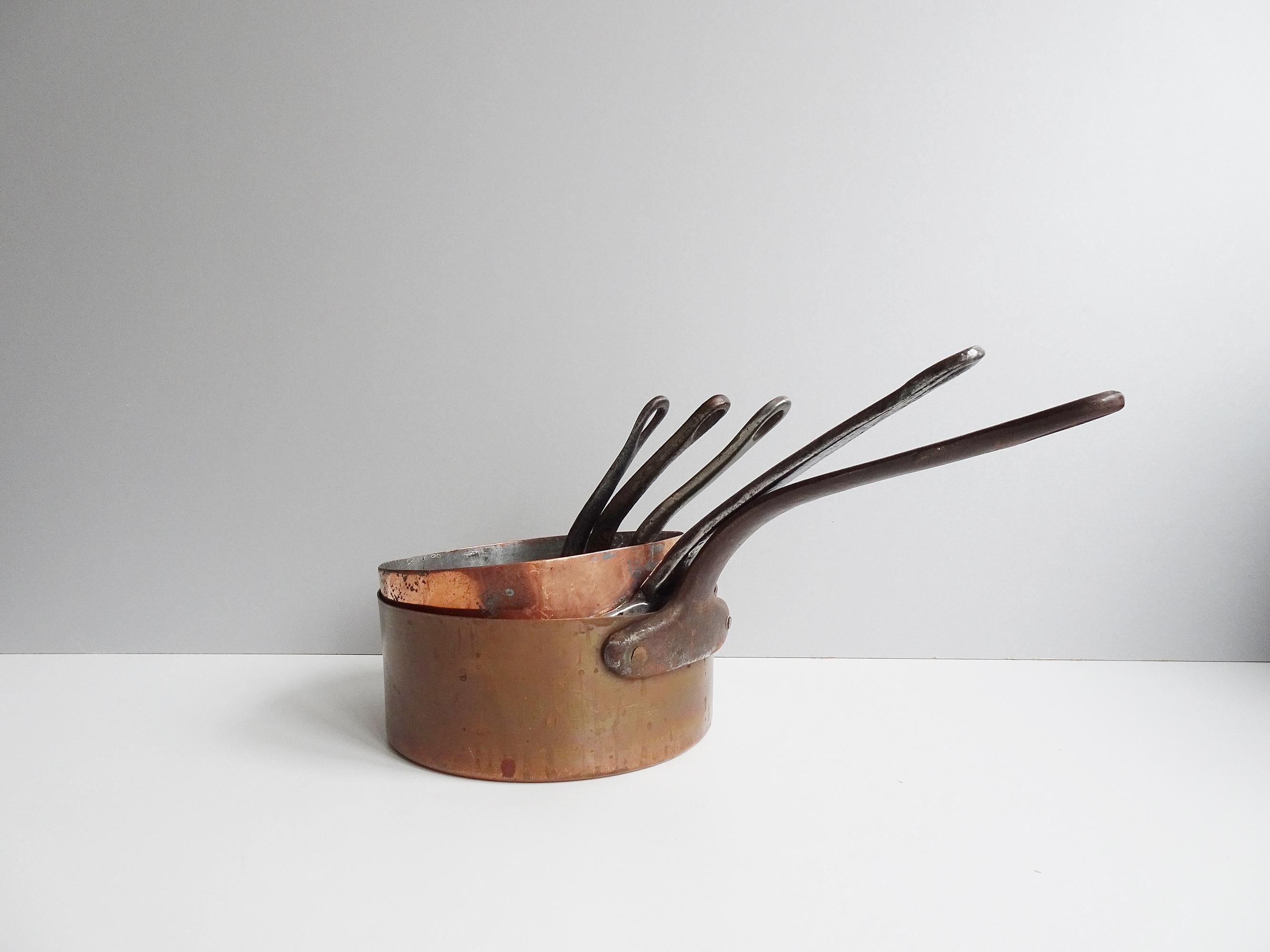 Five-piece casserole pan pot set for the kitchen, outdoor kitchen, or kitchen decoration. The pots in different sizes are not only very decorative but also very easy to store.

Traditionally French with a wonderful patina.

Copper with iron