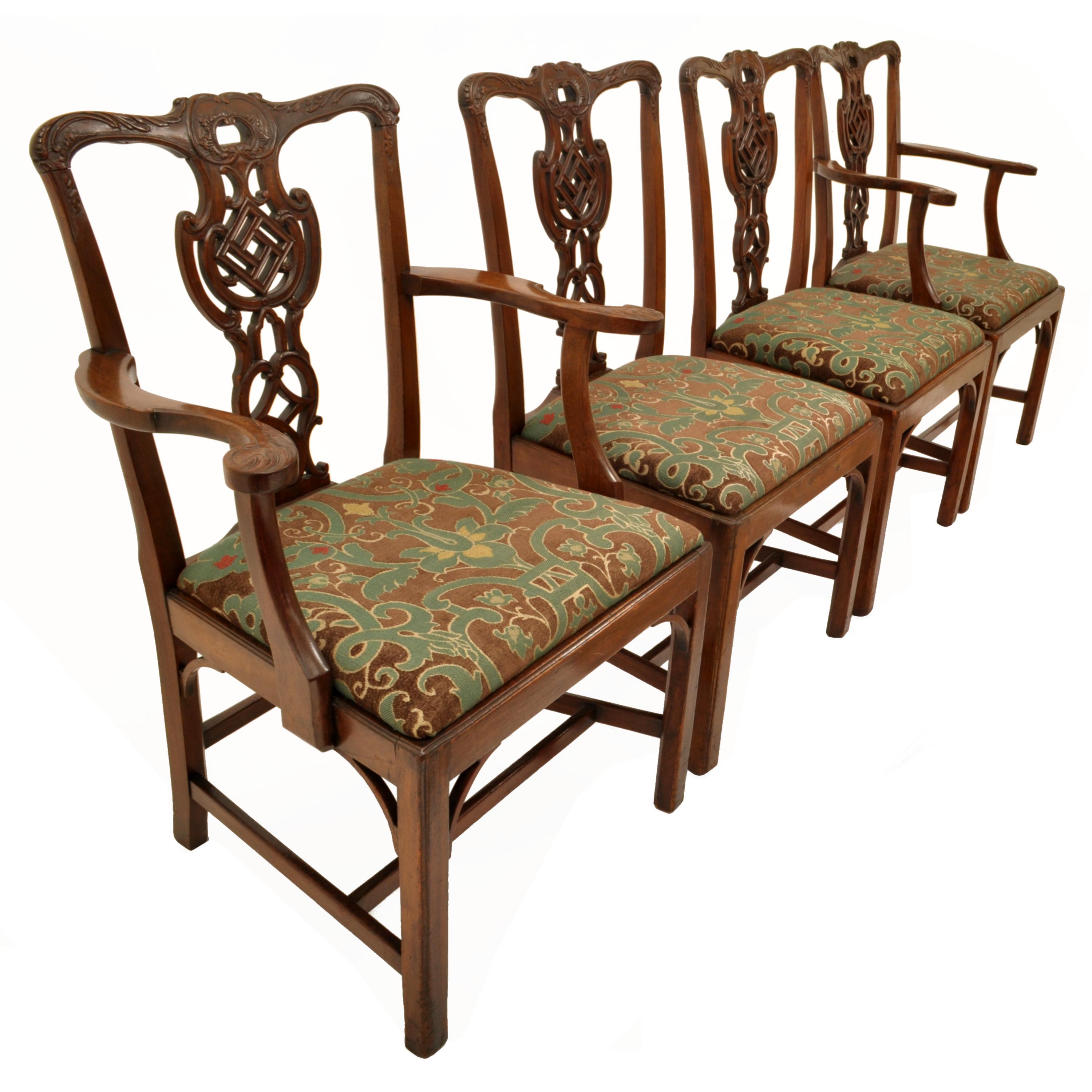 A good set of four antique Chippendale Revival carved mahogany chairs, circa 1890.
The chairs are finely carved from high quality solid mahogany, each chair having back rails & arms carved with acanthus leaves, the vaseiform backsplats are carved in