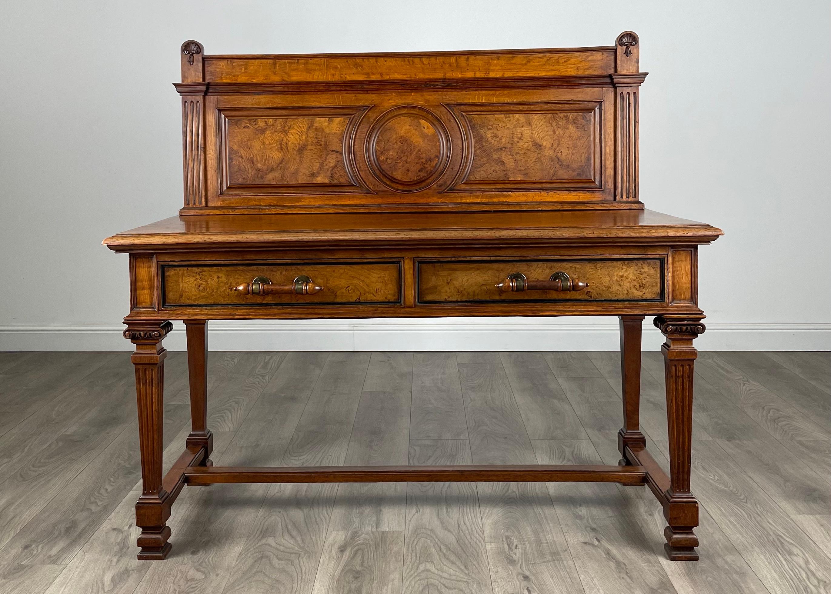 Exclusive Fine Quality Victorian Side Table / Console Table
In oak
Having two drawers to the centre both with stunning burr oak drawer front’s and their original brass handles.
The piece is stood on carved square legs with reeded decoration and a