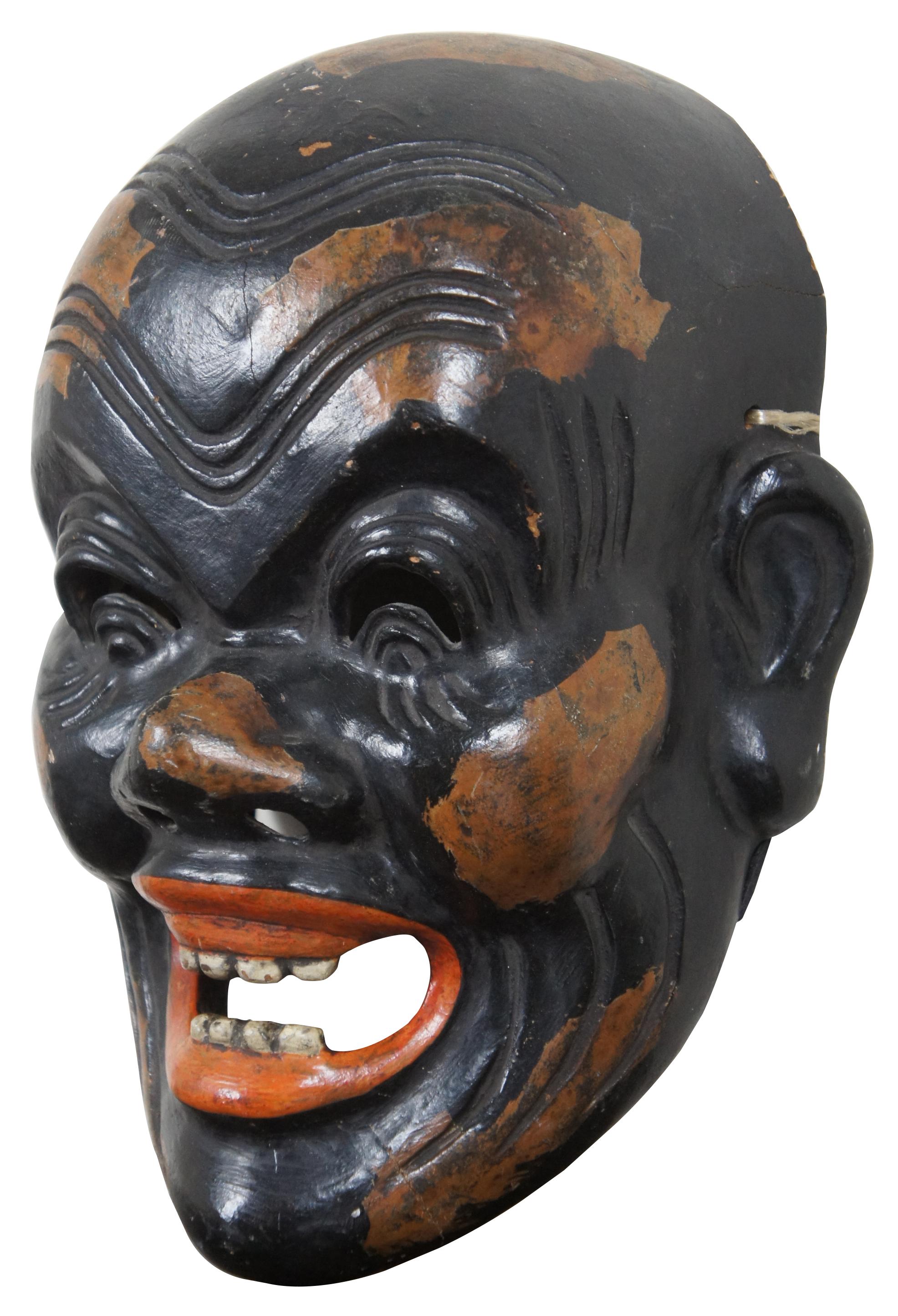 Antique Japanese Bugaku or Noh Mask, late 19th century antique Japanese Bugaku mask of an old man laughing. The mask is made of wood and lacquer. Hand painted and signed on the inside. Japan, late Edo or early Meiji period. The character is known as