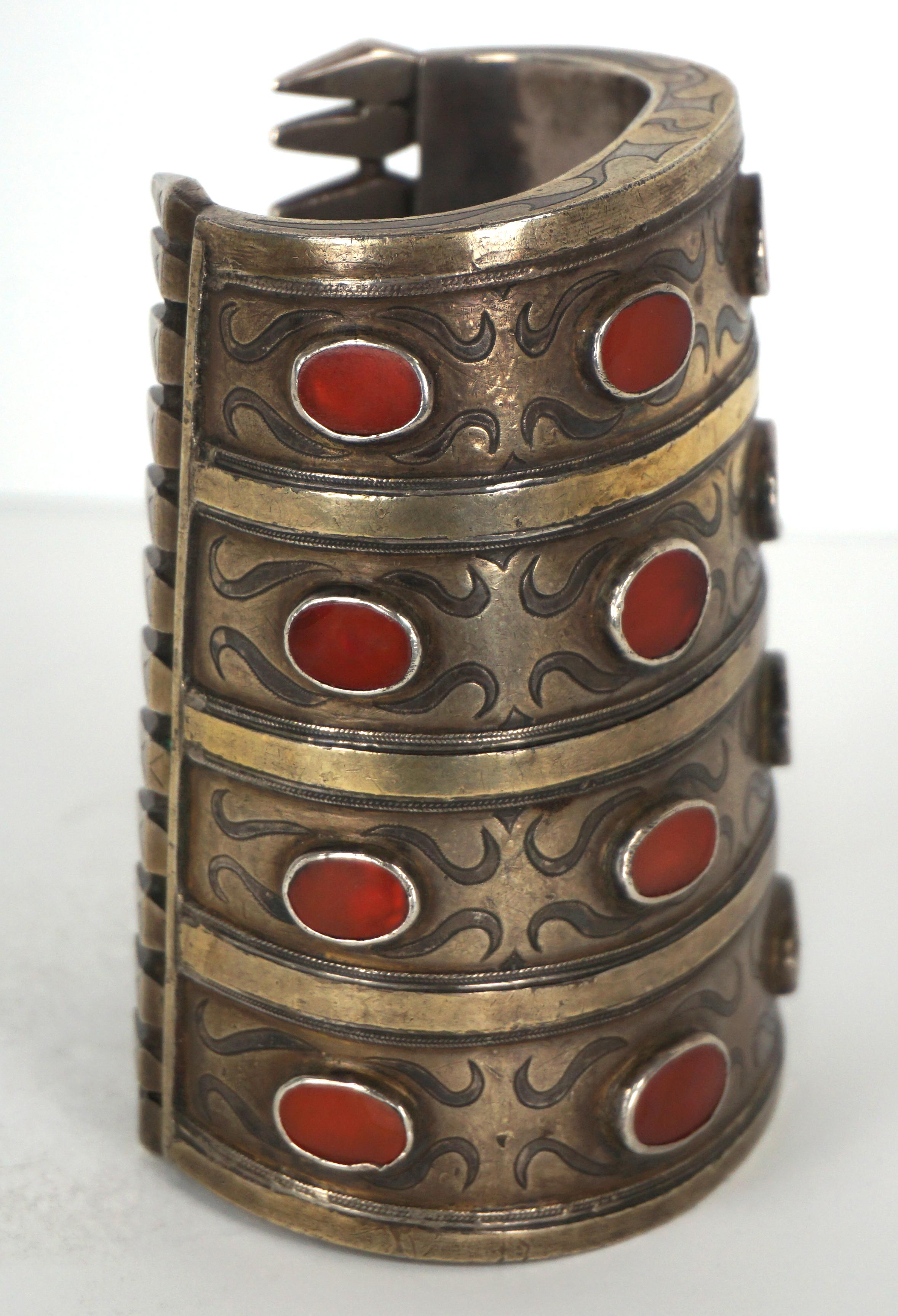 Beautiful Tekke/Turkmen cuff/armlet armlet, known as bilezik, is decorated with four rows of table-cut semi-precious Carnelians. The cuff is for a small boned person (internal diameter at smallest point is 2