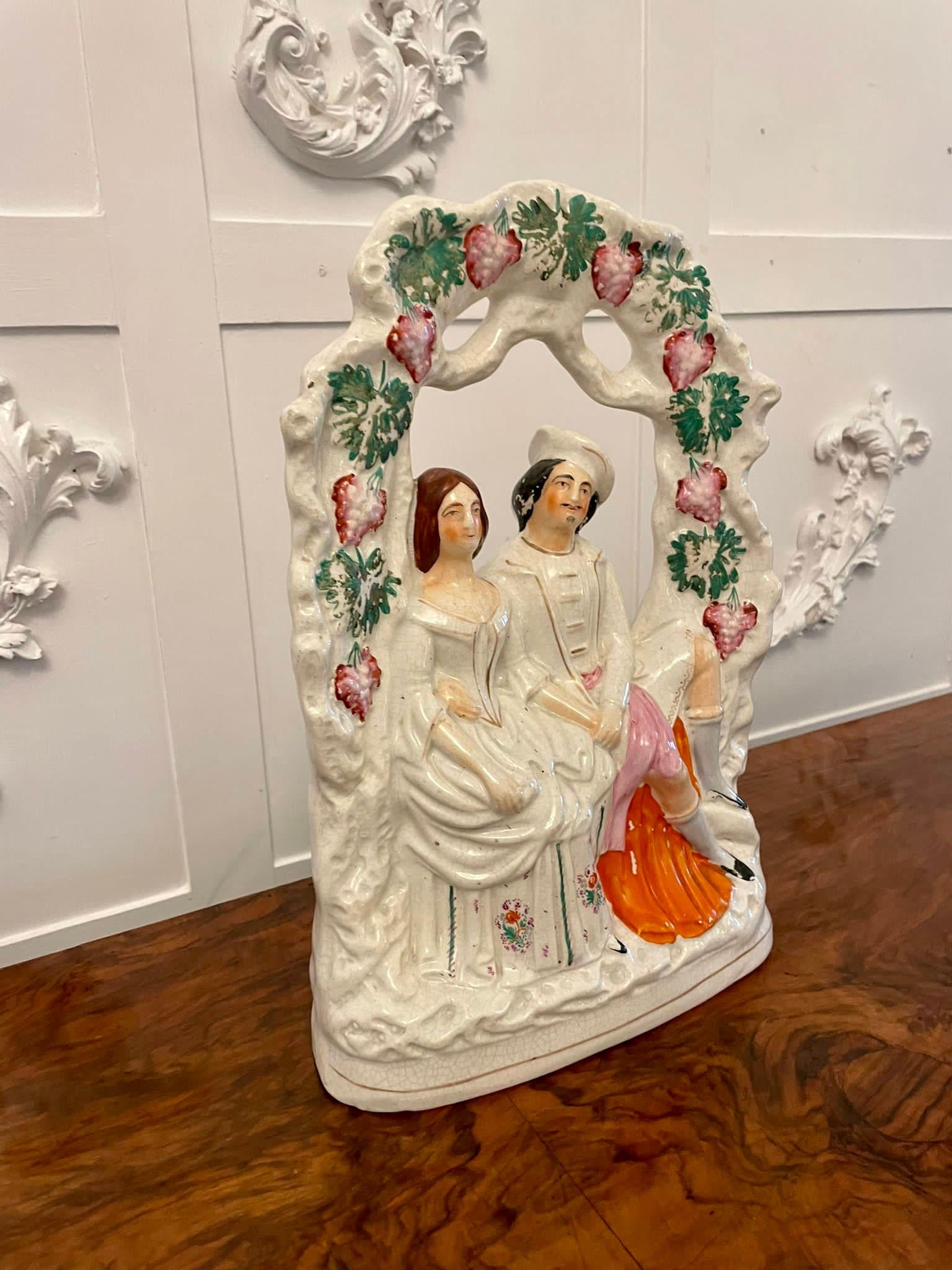 Antique 19th century antique Staffordshire flatback of a wedded couple seated under grape vines dressed in period wedding costume

A delightful piece which is beautifully colored and in perfect condition

Dimensions:
H 35.5 x W 24 x D