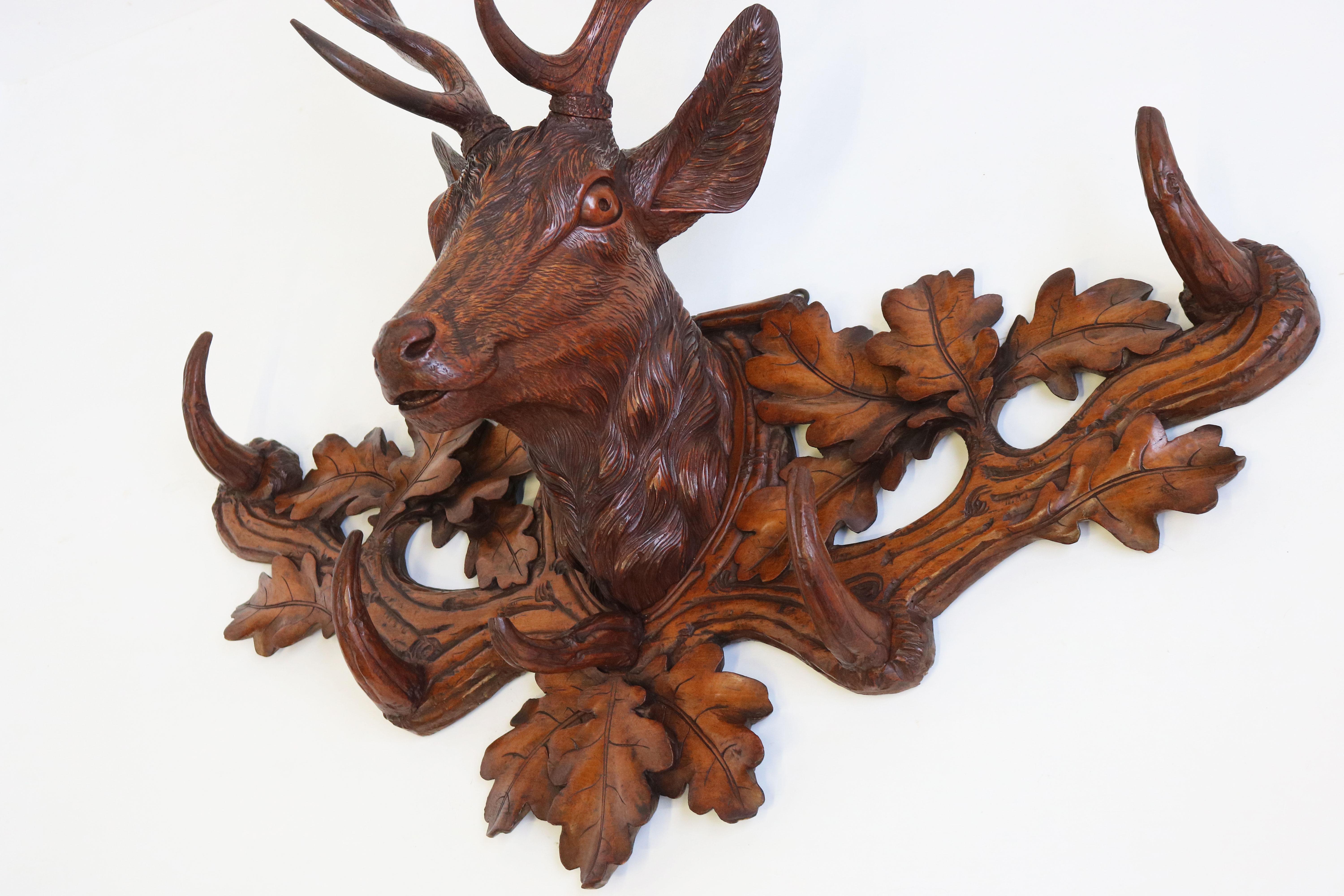 One of the finest Black Forest pieces we ever had the pleasure of selling. 
This most impressive hand-carved Stag Coat Rack in the Black Forest style from Switzerland 19th century. 
The coat rack has all 5 original hooks , fixed on a branch &