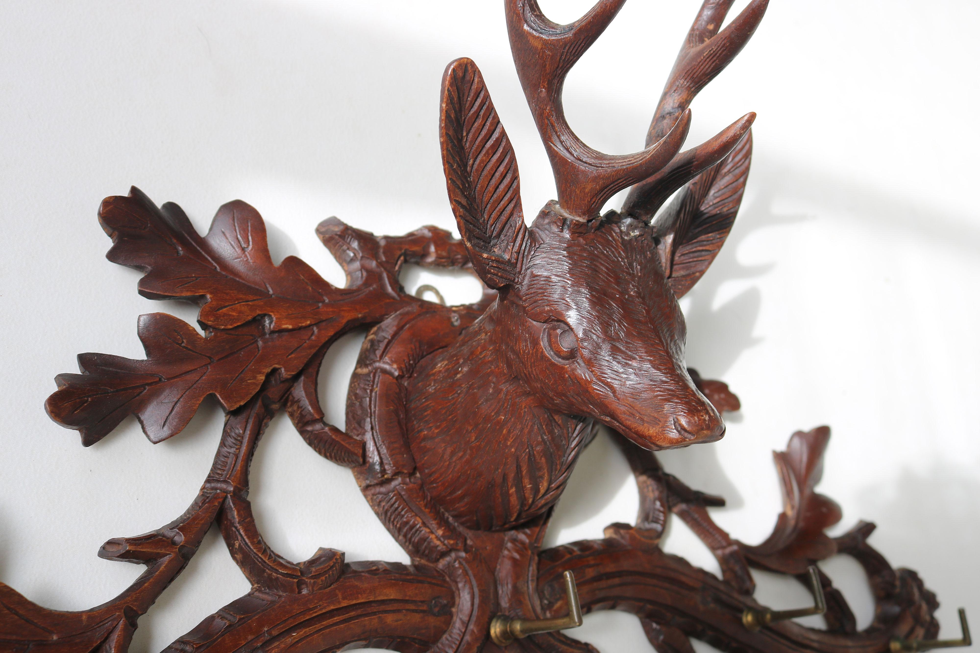 Gorgeous small coat rack / kitchen rack from Switzerland 1890s hand carved Black Forest stag with brass hooks. 
This will look simply amazing in your kitchen hung full with towels or in your hallway 
Fully hand carved displaying a stag with antlers