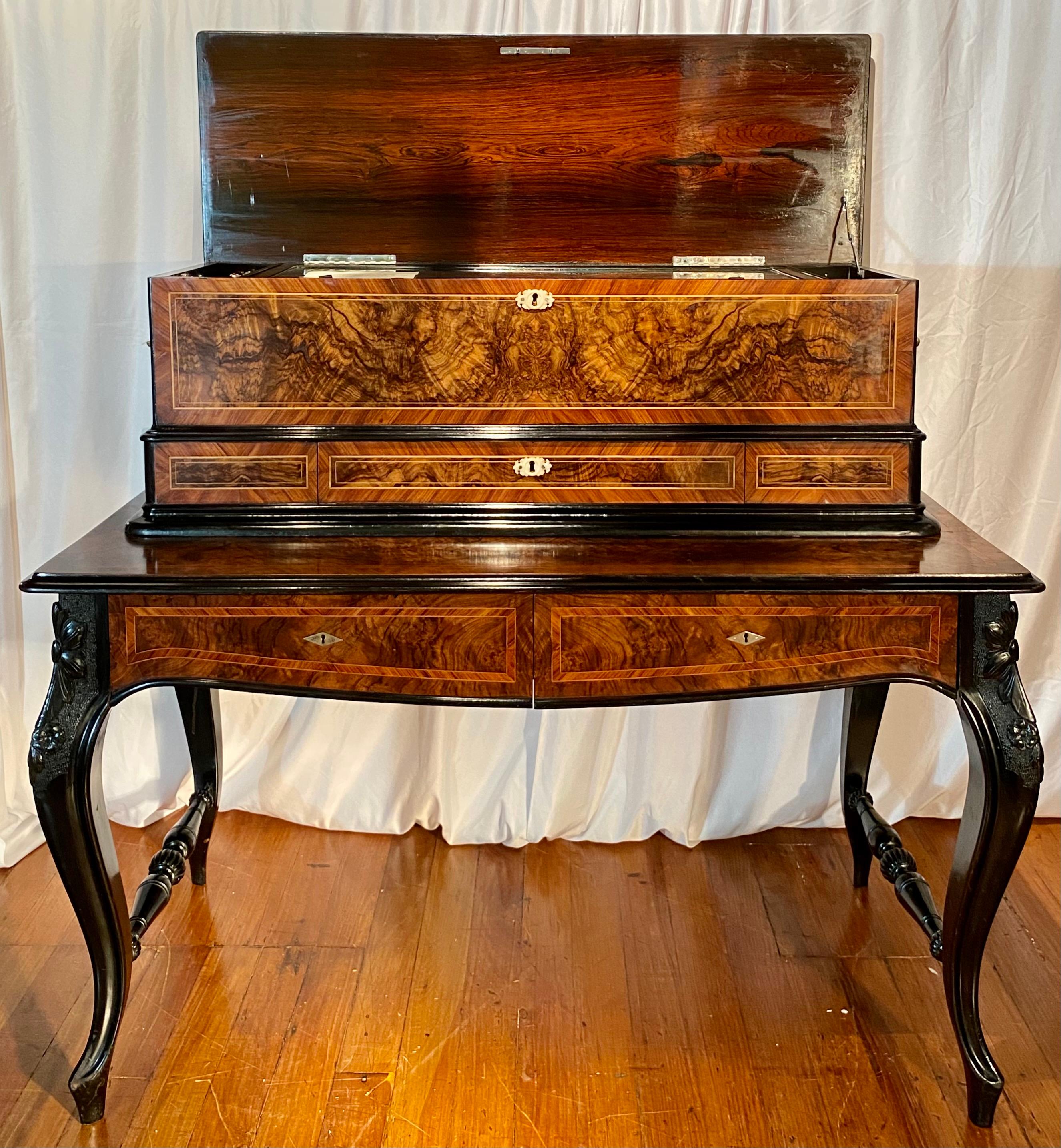 Antique 19th century Swiss burled walnut inlaid and cross banded music box on stand, contains 10 Cylinders each playing 6 musical pieces, a masterpiece of engineering and cabinetmaking. 
MBOX004.