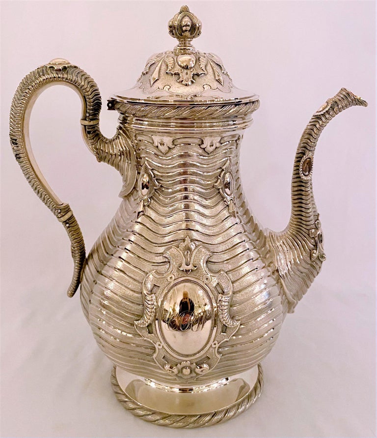 Museum quality antique sterling silver coffee and tea set made for Tiffany & Company New York, Circa 1843. By Grosjean & Woodward, master silversmiths, for Tiffany & Co., 550 Broadway, New York City. 
The set consists of 6 pieces:
Coffee pot
