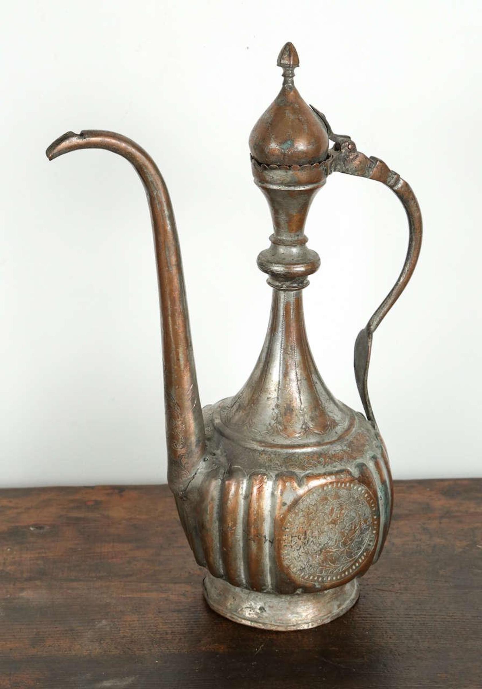 Antique 19th century Asian, Middle Eastern style Turkish tinned copper ewer.
Antique Turkish ottoman Islamic Ewer Tombak pitcher brass copper Ibrik.
Nice antique decorative hand-crafted and hammered Moorish ewer in the Mameluke style.
Antique