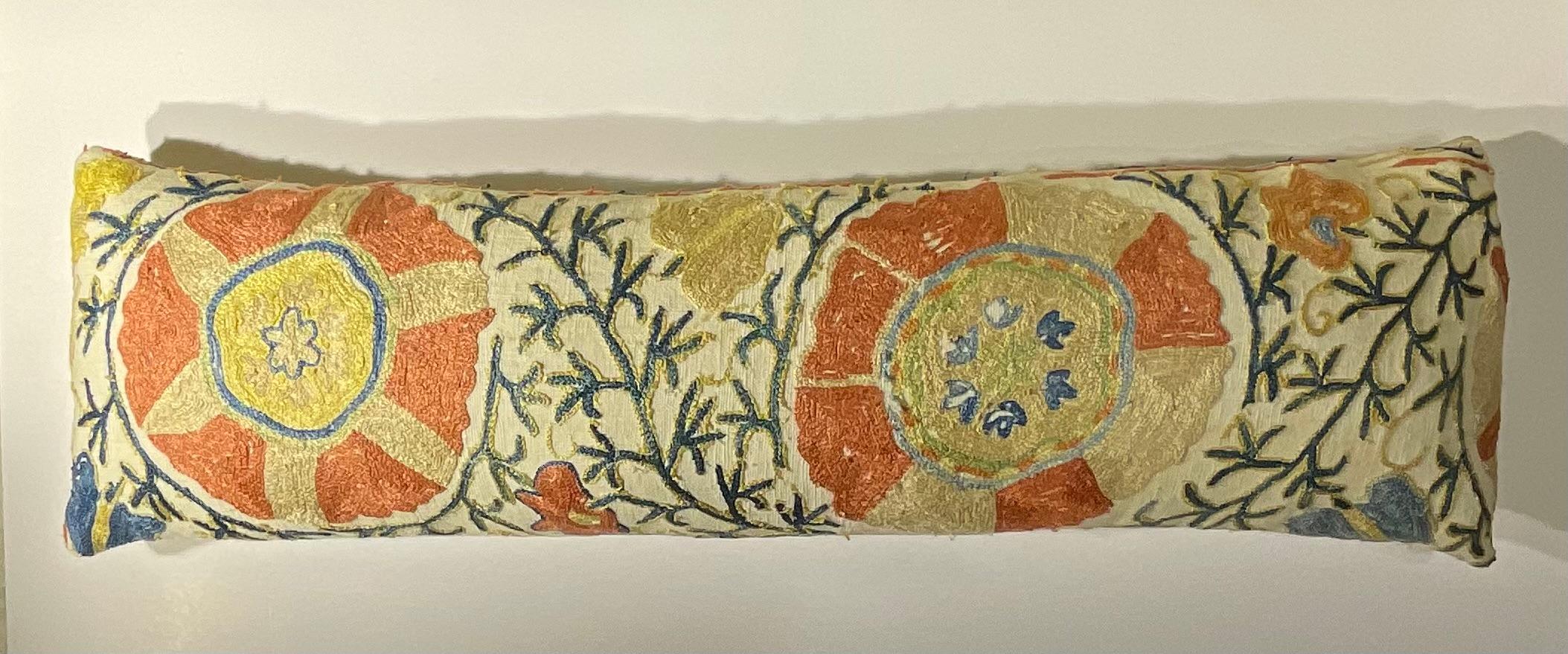

A Timeless Piece of Central Asian Art:
Bring a piece of history and unparalleled artistry into your home with this exquisite, one-of-a-kind lumbar pillow. Meticulously handcrafted from an authentic 19th-century suzani textile fragment, this pillow