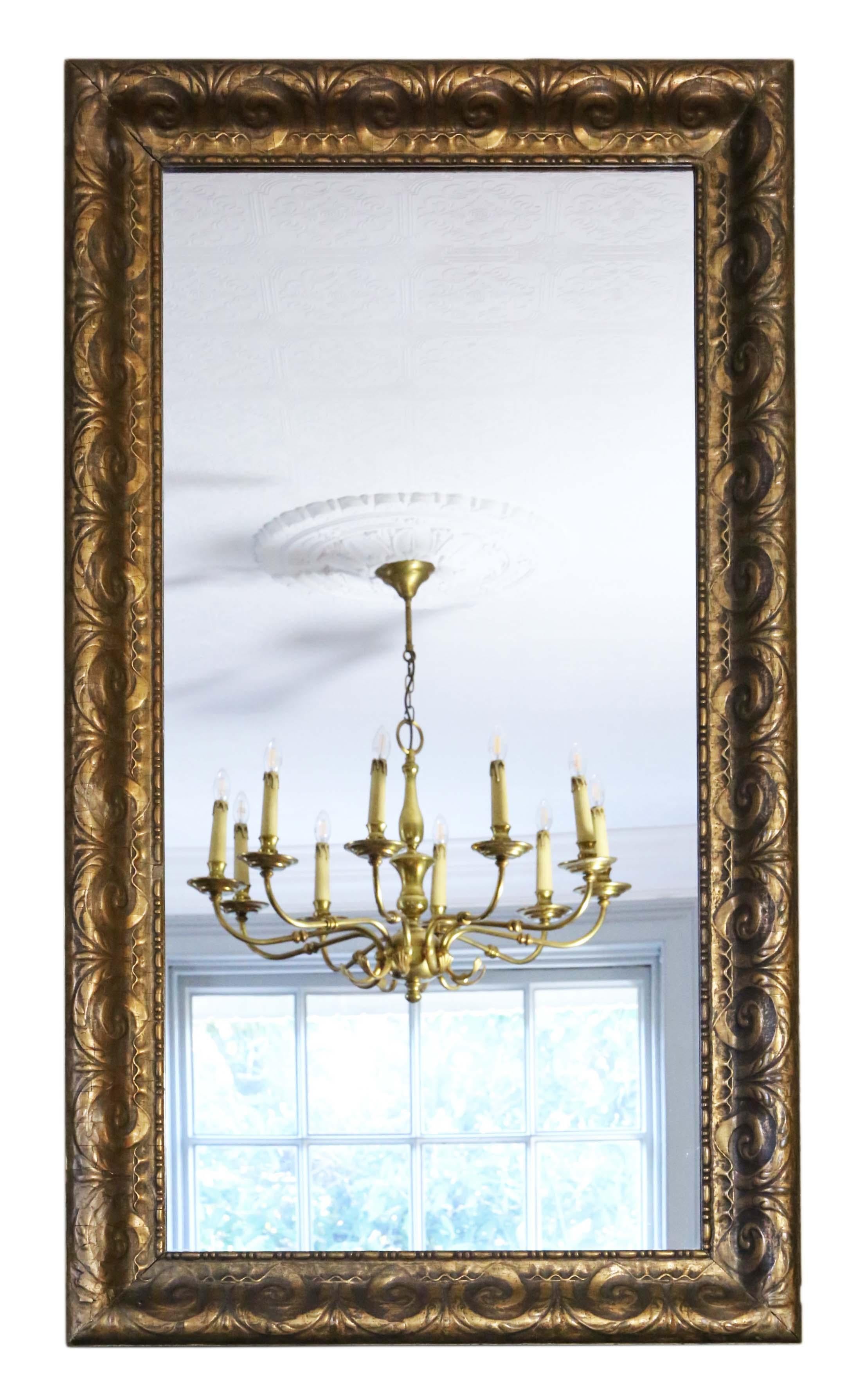 Antique 19th Century large quality gilt wall mirror or overmantle.

An impressive rare find, that would look amazing in the right location. No loose joints or woodworm.

The later mirrored glass is in good condition.

Overall maximum