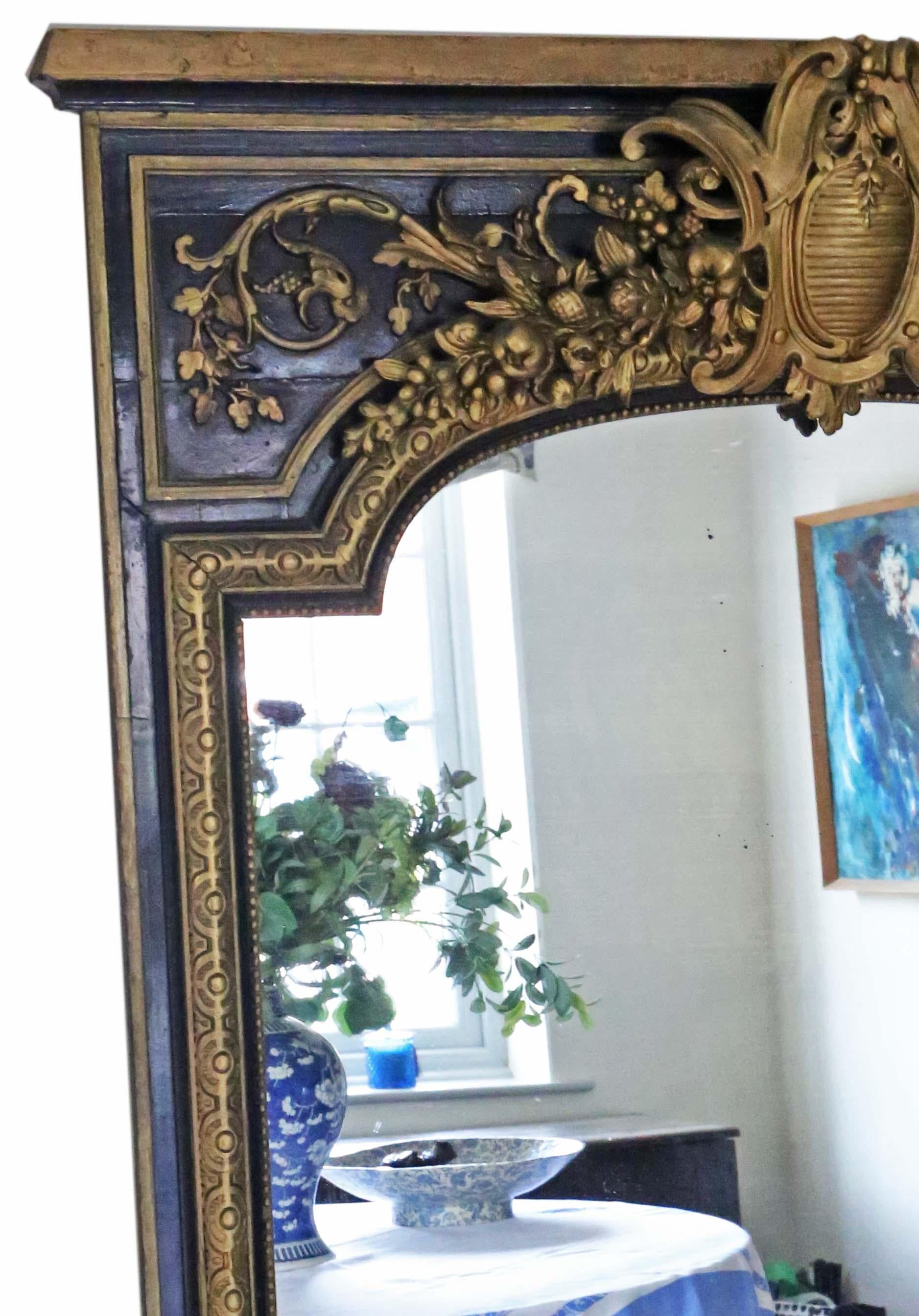 Antique 19th century very large quality ebonized and gilt floor wall overmantle mirror.

An impressive rare find, that would look amazing in the right location. No loose joints or woodworm.

The original mirrored glass has light oxidation, some
