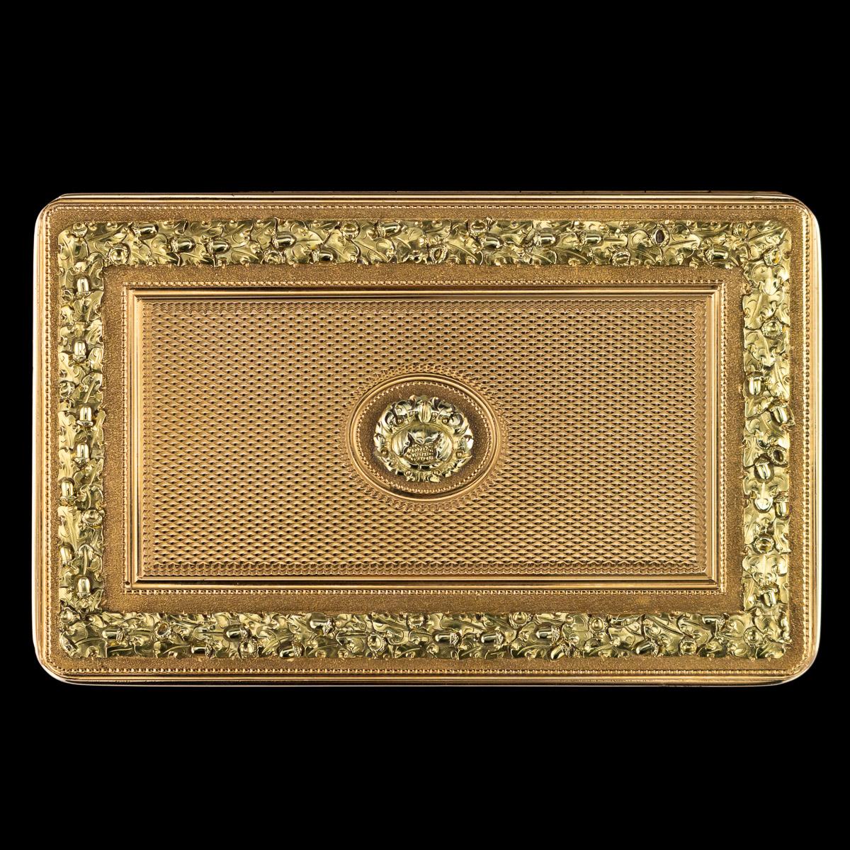 Antique early 19th century Victorian 18-karat two-color gold snuff box, rectangular shaped, cover and base profusely applied with acorns and oak leaves, on an engine turned ground, the interior cover with Political presentation
