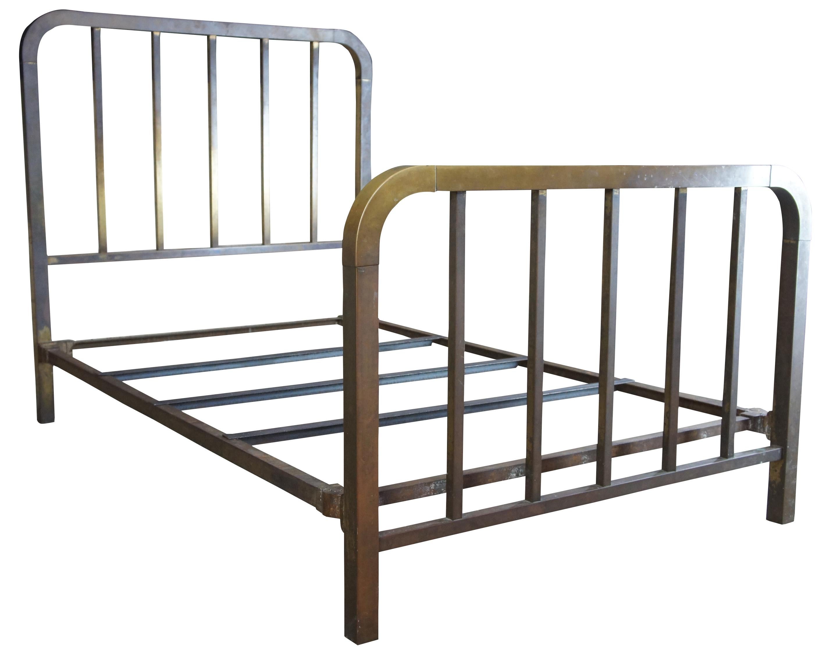 Antique brass and iron bed frame. Features square cut posts and turned corners.

 Foot board height 36.6