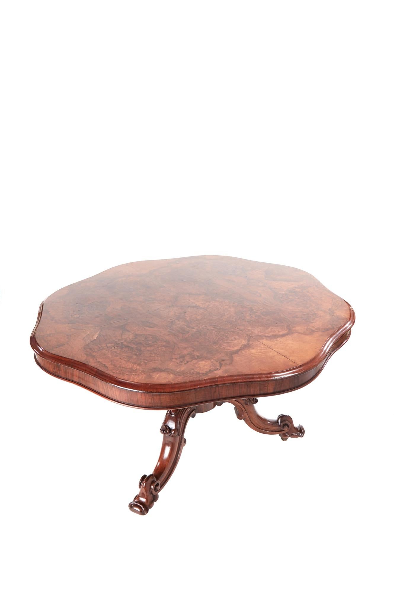 Finest quality antique Victorian burr walnut shaped centre table with a tilt-top having exceptional matched burr walnut veneers. It has a thumb moulded edge and a solid walnut base with a shaped reeded centre column. It is supported by three shaped