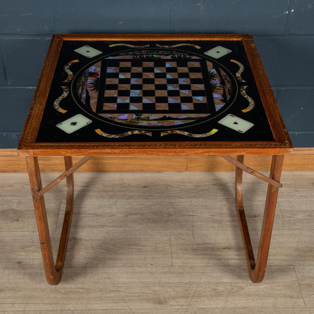 Antique 19th Century extremely rare foldable games table. This type of workmanship was quite popular in the Victorian era. The glass top is reverse painted, leaving sections of the glass transparent. These transparent sections were then decorated