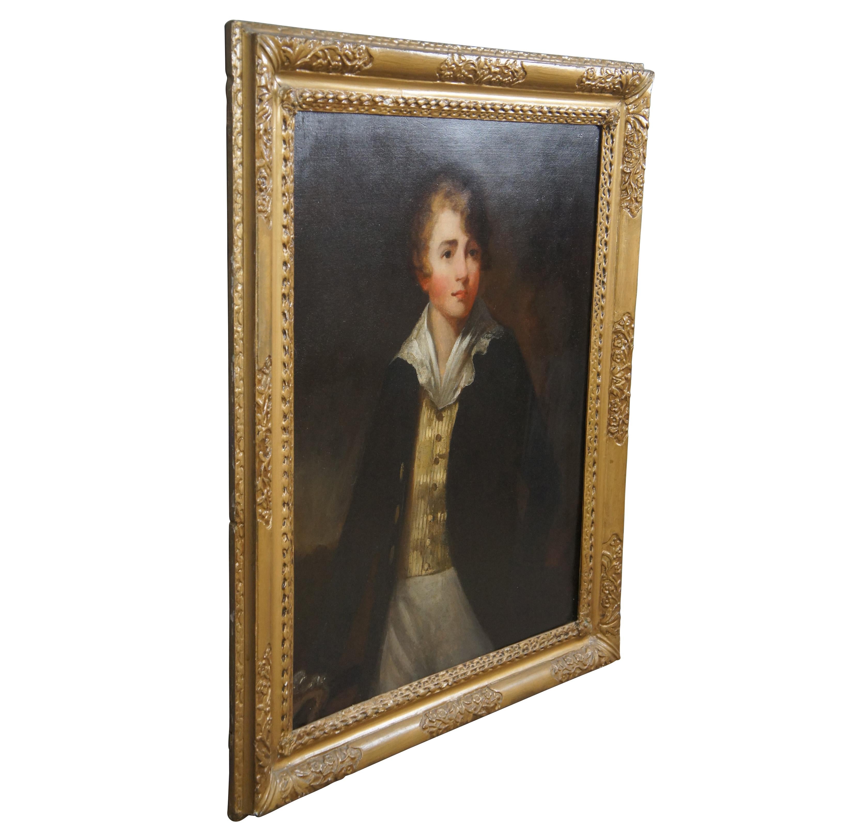 A lovely Victorian era oil painting of a stately young fellow posing in a yellow silk button down and formal jacket. The painting is neatly framed in gold with acanthus, foliate and diamond pattern detail. Canvas is marked along the top stretcher