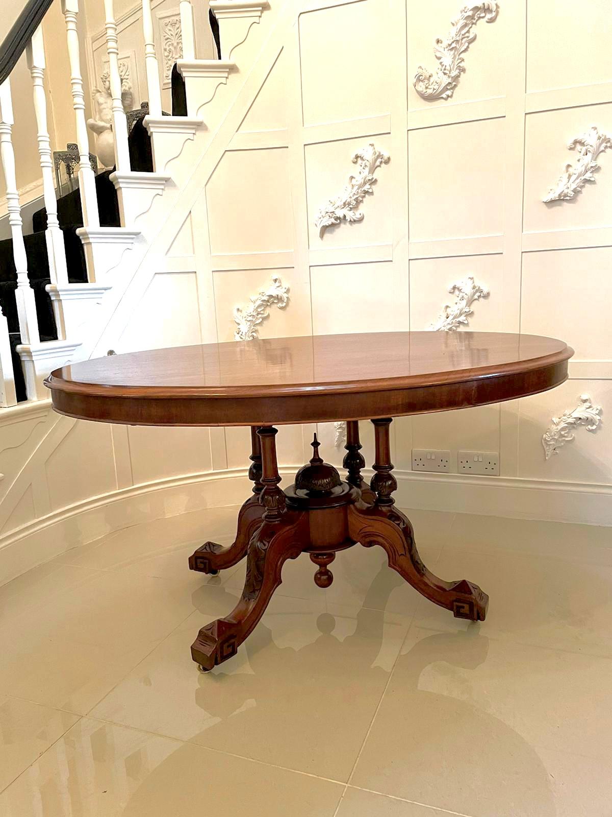 Antique 19th century Victorian oval mahogany centre table having an attractive quality mahogany tilting top with a thumb moulded edge, oval mahogany frieze supported by four glorious turned columns standing on four beautifully shaped and carved