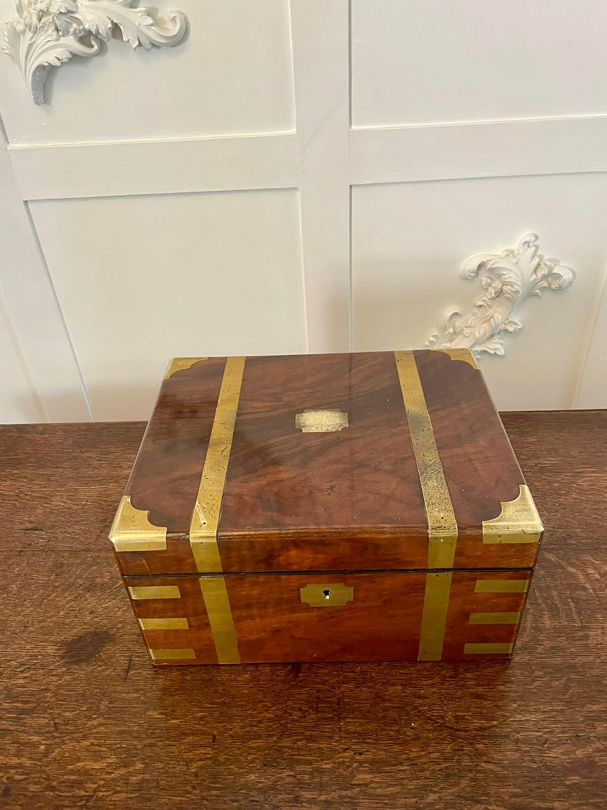 Antique 19th Century Victorian quality burr walnut writing box with brass bound corners and straps opening to reveal a fitted writing slope, pen tray, original ink bottle, two lift up lids opening to reveal a storage compartment and two secret