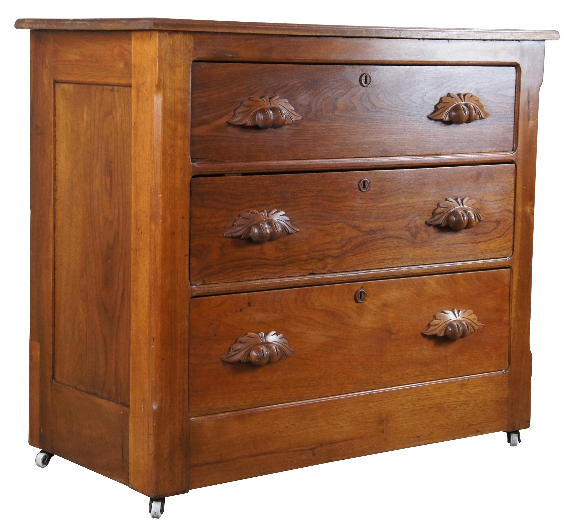 A beautiful American Victorian era dresser. Made from walnut with three dovetailed drawers and chamfered corners. The drawers are dovetailed via the Knapp Joint. Features carved fruit and nut pulls and porcelain casters. 

The Knapp joint was