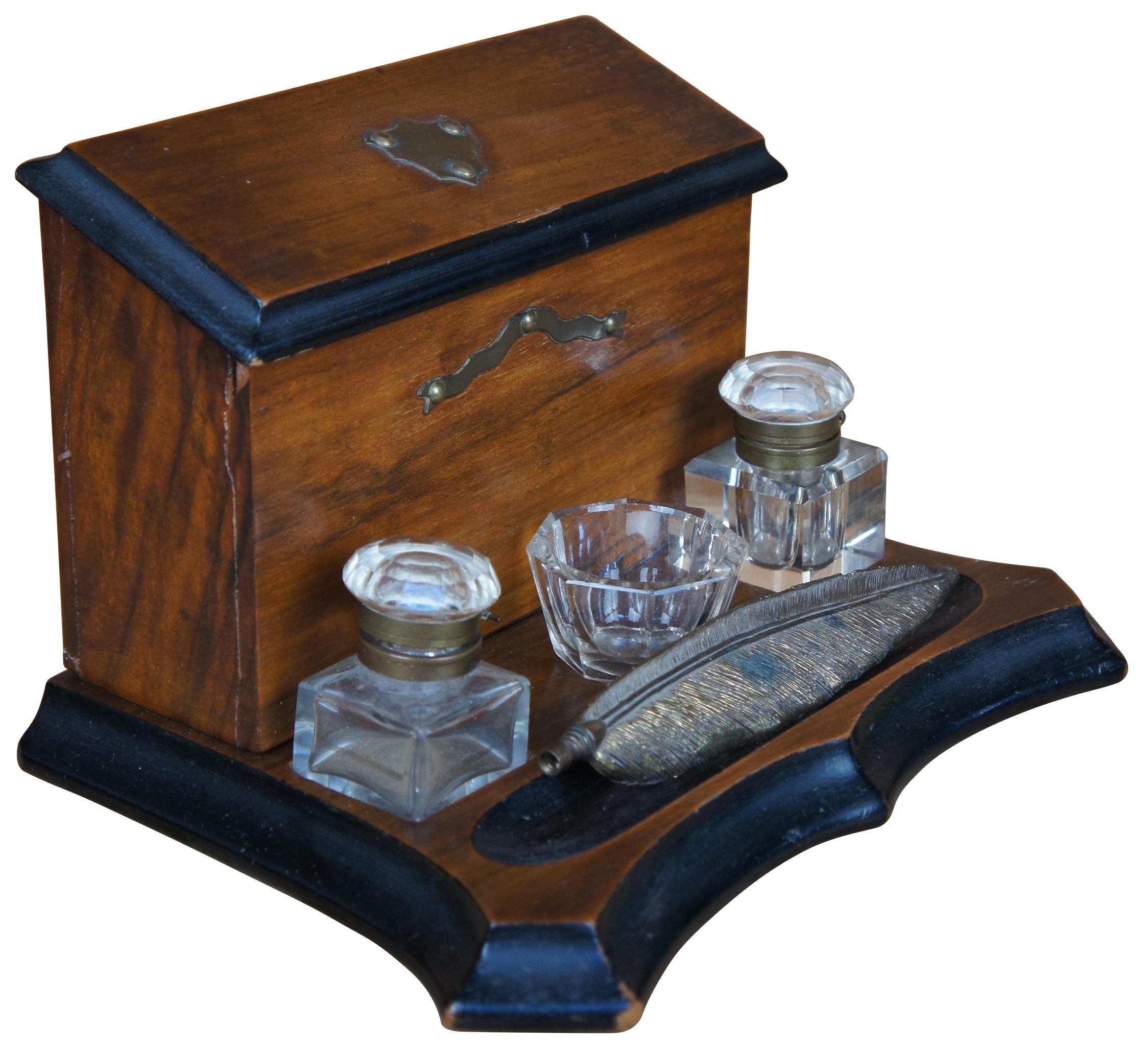 Wood base writing desk set with letter/paper holder, two glass and brass inkwells and feather pen. Size: 11