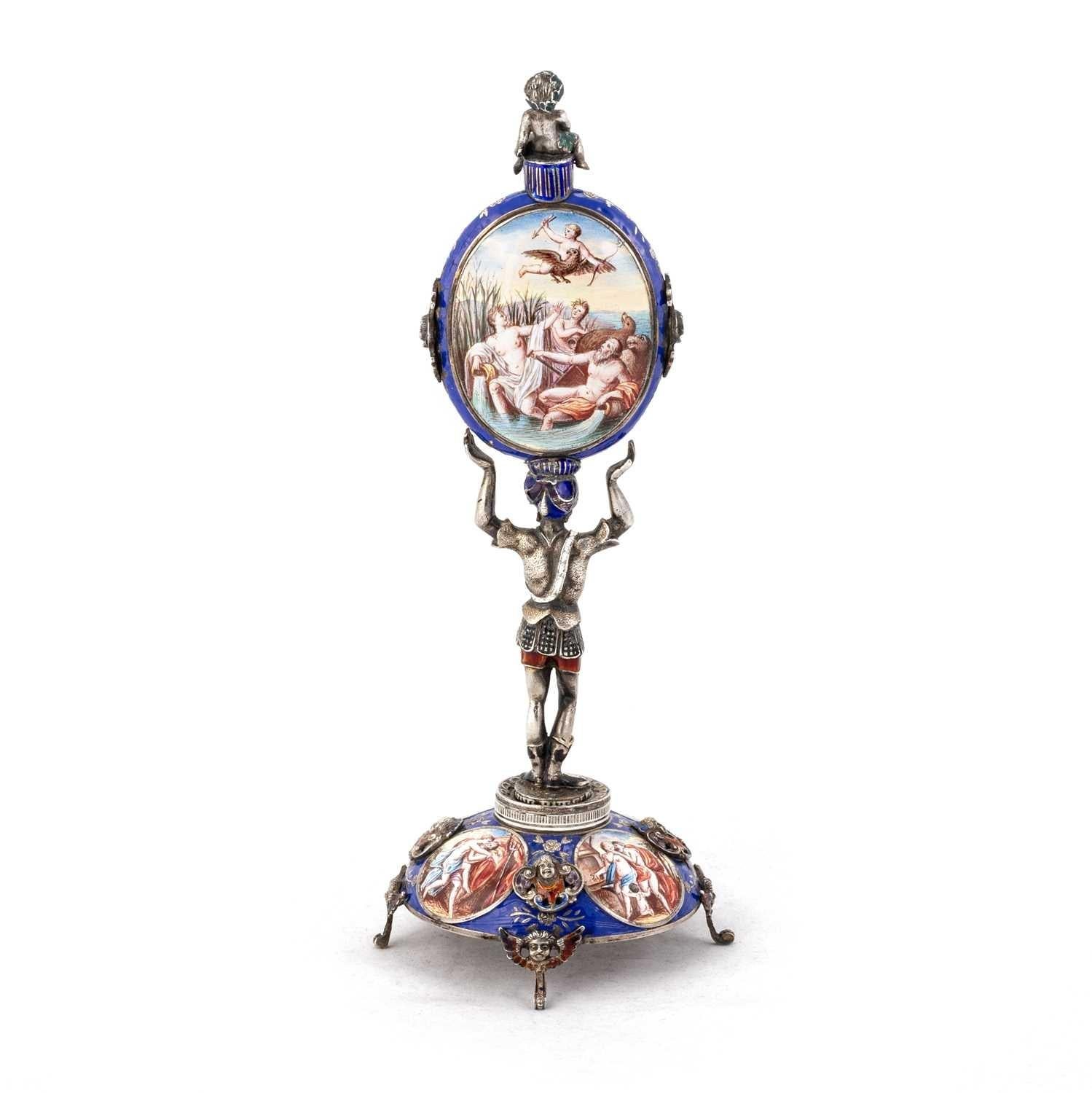 A rare and very fine Viennese (Austrian) table/desk figurative silver standing clock,  finely hand-painted with enamel depicting allegorical scenes to base, each roundel spaced with a bas-relief mask. 

From a private English collection
Free