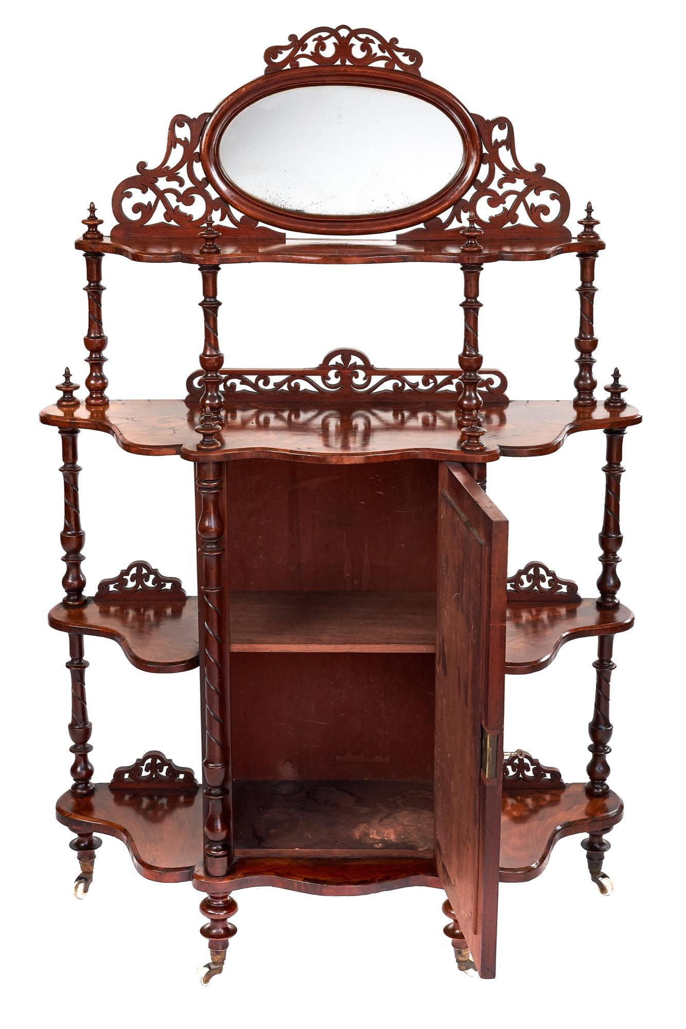 Antique 19th century walnut 4-tier whatnot with oval walnut framed mirror surrounded with the most attractive fretwork decoration. The second tier having an elegant fretwork upstand and the centre mirrored cupboard with original key opens to reveal