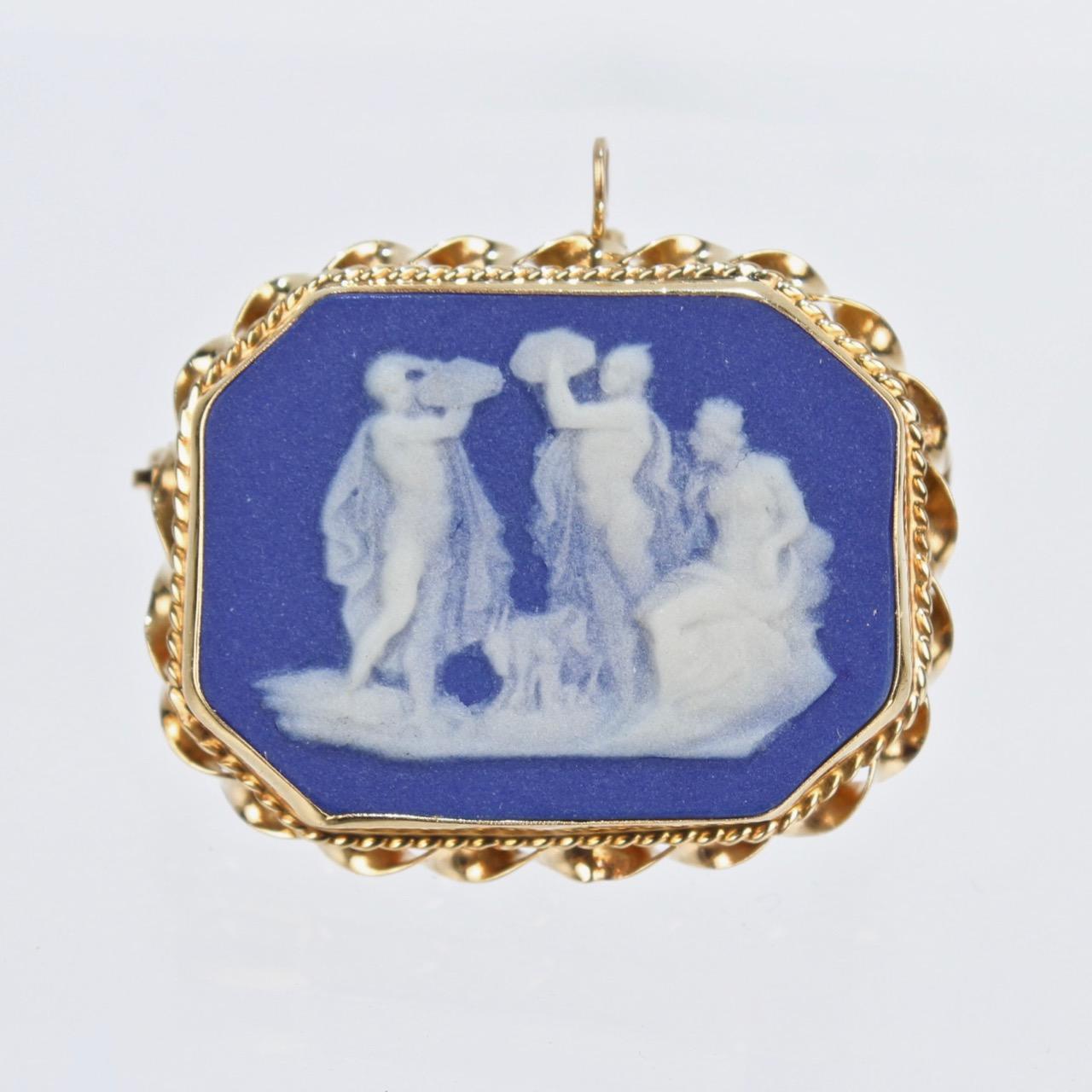 A wonderful antique Wedgwood blue jasperware and 14k gold pin and pendant combination.

The early 19th century plaque was finely bezel set in 14k gold in the early to mid 20th century by a clearly capable jeweler. 

It can be worn both as a brooch