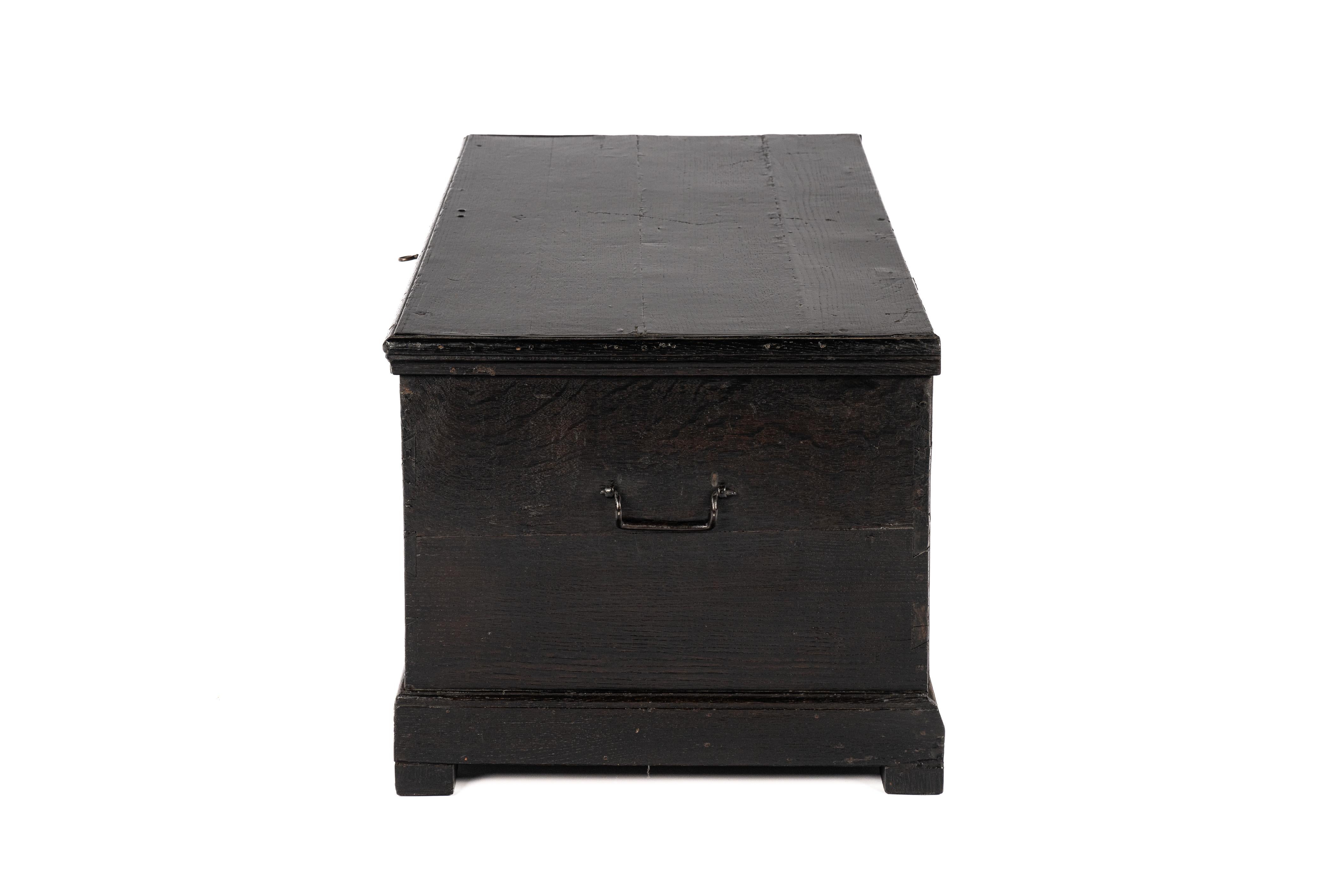 Lacquered Antique 19th-century West German black oak blanket chest trunk or coffer For Sale