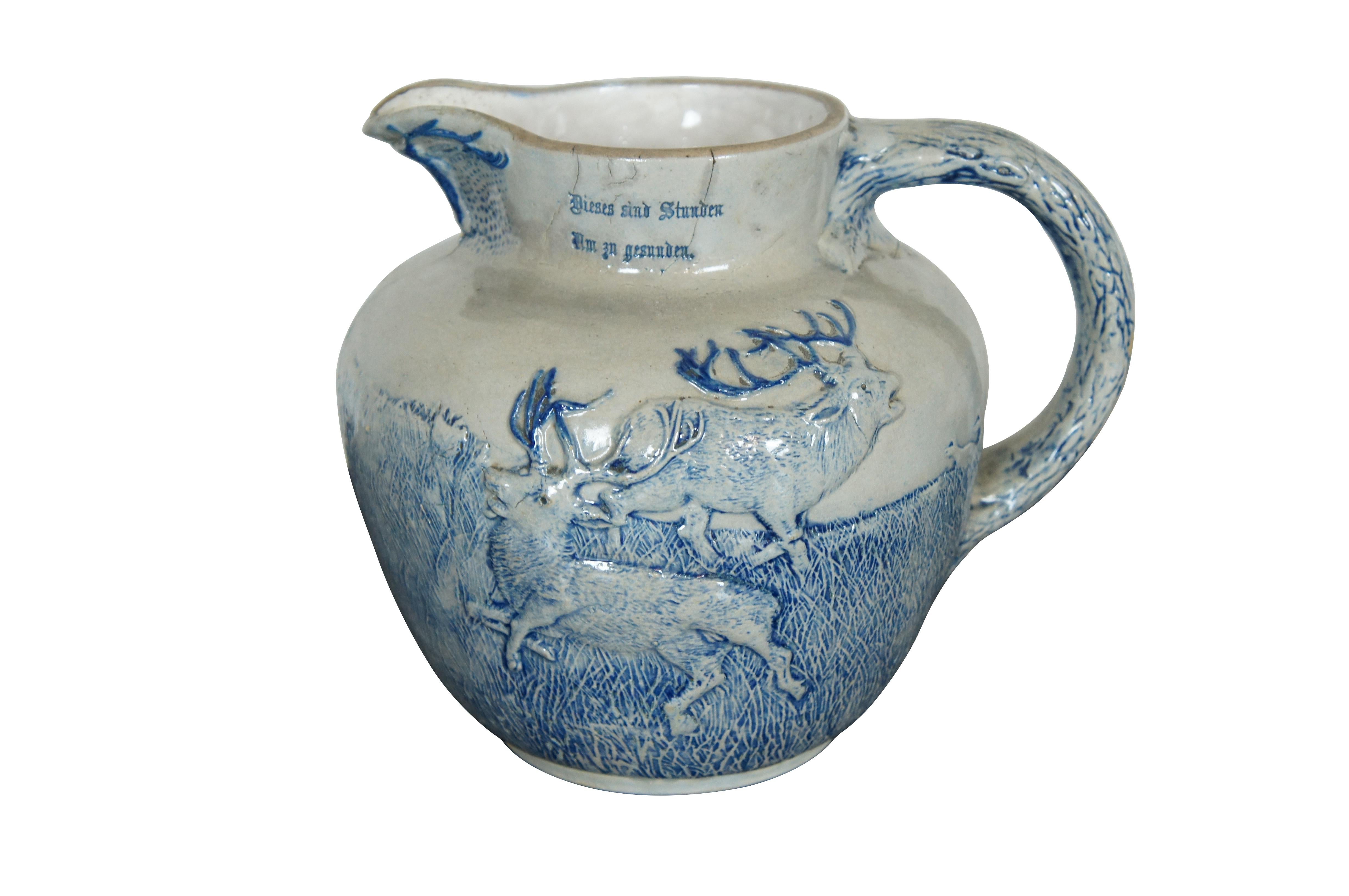 An antique White Utica Salt Glaze pitcher with German Hunt Scene.  Text reads: Dieses sind Stunden Am zn gesuuden. / Mit dem Liebchen vereient Brim rollem Becher. Translation 