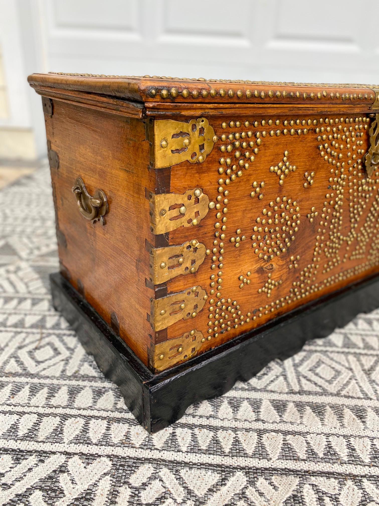 Hand-Carved Antique Zanzibar Chest in Teak Wood with Brass Overlay and Studs For Sale