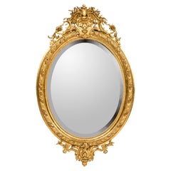 Miroir ovale français ancien du 19ème siècle de style Louis XVI, doré à la feuille d'or avec verre facetté