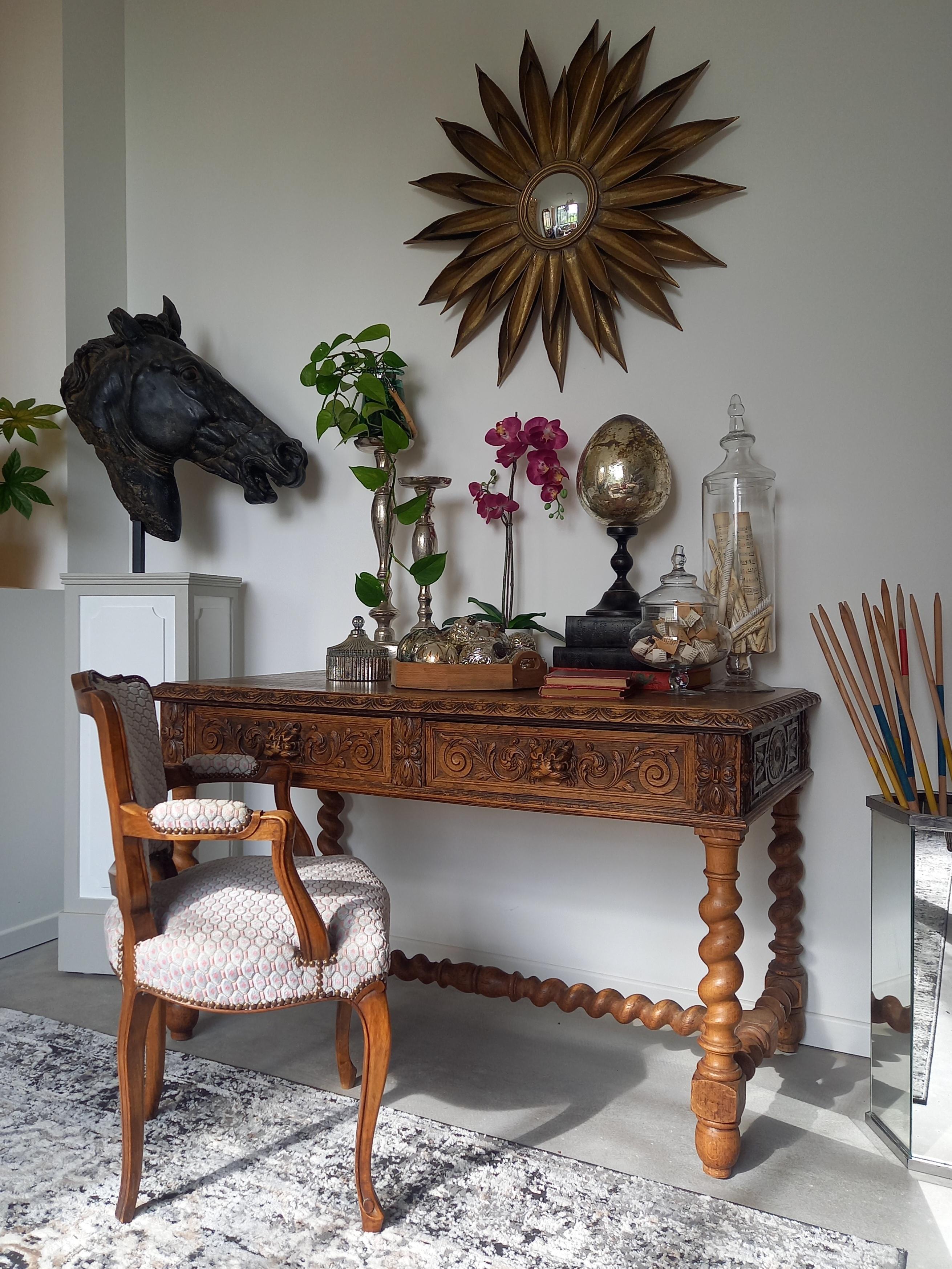 Antique Louis XIII carved table in renaissance style, in oak, of perfect dimensions to be a center table, a desk, or a console table, with its belt is admirably worked on all four sides. 
The sculptures are symmetrical and representative of the
