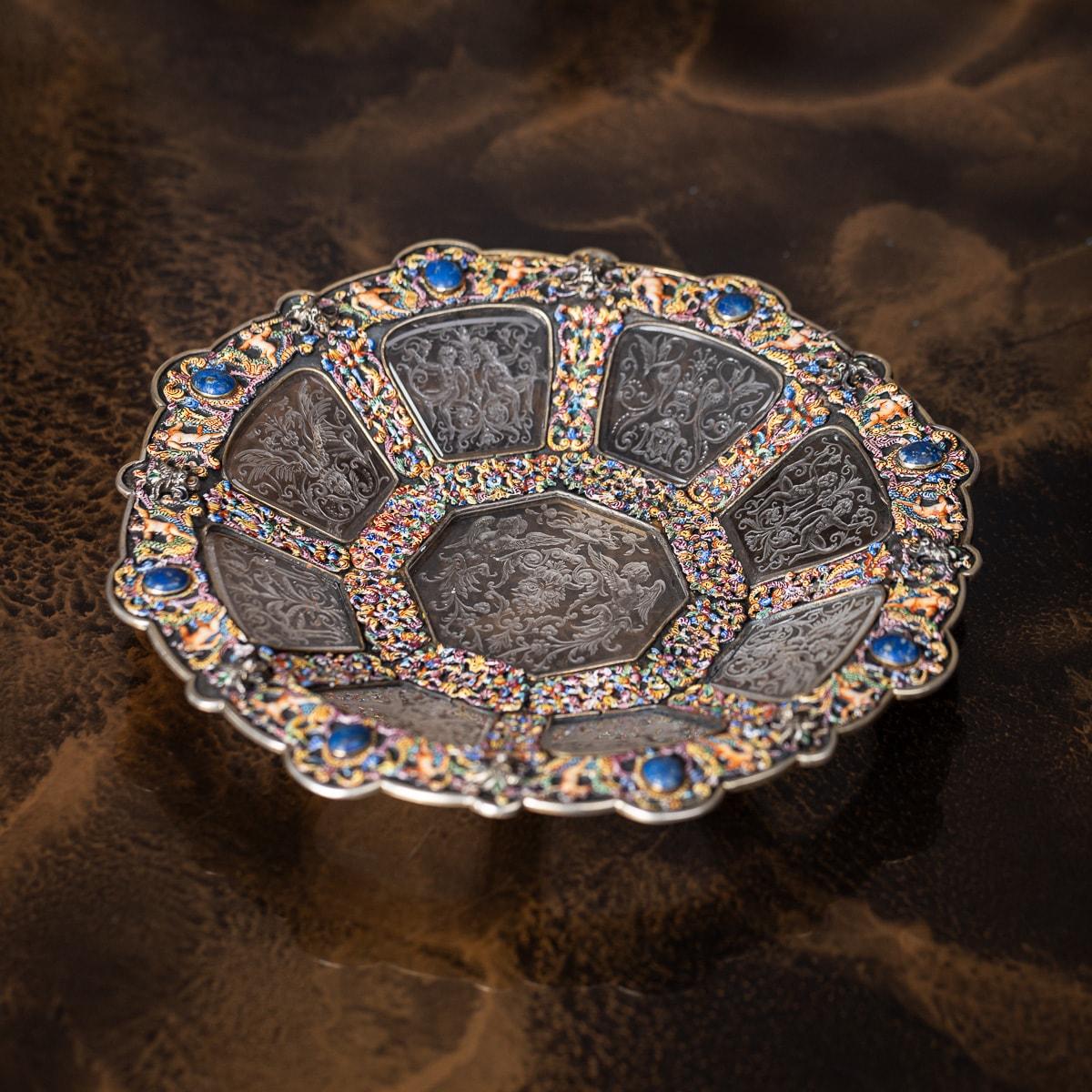 Antique 19th Century Austrian rare and unusual solid silver-gilt & enamel rock crystal dish. Enamelled with putti and pierced floral decoration, the frame set with blue cabouchon lapis lazuli and eight engraved rock crystal panels surrounding a