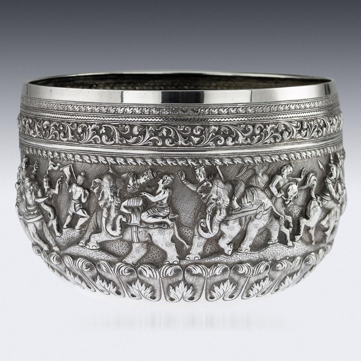 Antique late-19th century exceptionally rare Burmese, Myanmar solid silver Thabeik bowl, repousse' decorated in high relief depicting battle scenes and traditional scenes from the Burmese mythology, detailed figures set against a chiseled matted