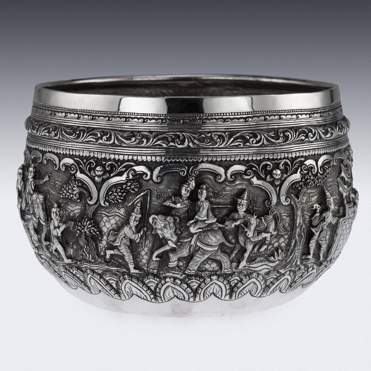 Antique late-19th century Burmese (Myanmar) solid silver thabeik repousse' bowl, very well made and heavy gauge, repousse' decorated in high relief with six different scenes from the Burmese mythology, representing various figures and animals in a