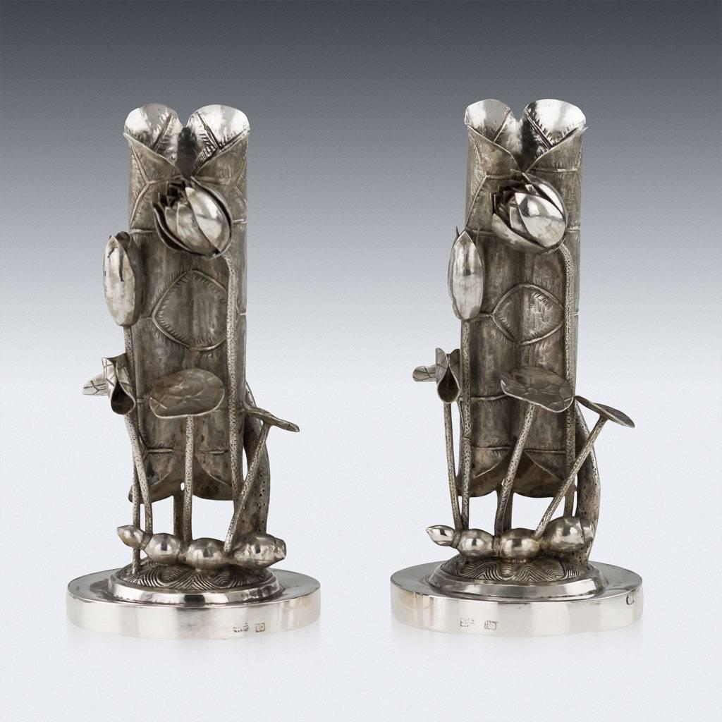 Antique 19th century rare Chinese solid silver decorative pair of vases, realistically modelled as pair of closed lotus flowers, standing on a hand-carved, pierced wood bases and fitted in the original presentation box. Made by the renowned