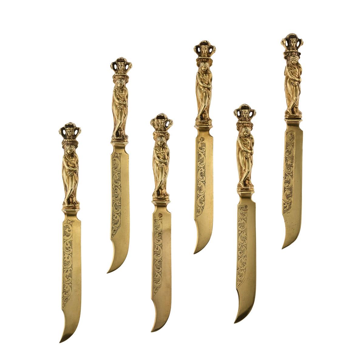 Antique mid-19th century German extremely rare Renaissance style 14-karat solid gold cutlery set, comprising: six spoons, six forks and six knives. The finely modelled, cast figural handles in form of a loosely draped woman, one arm seductively