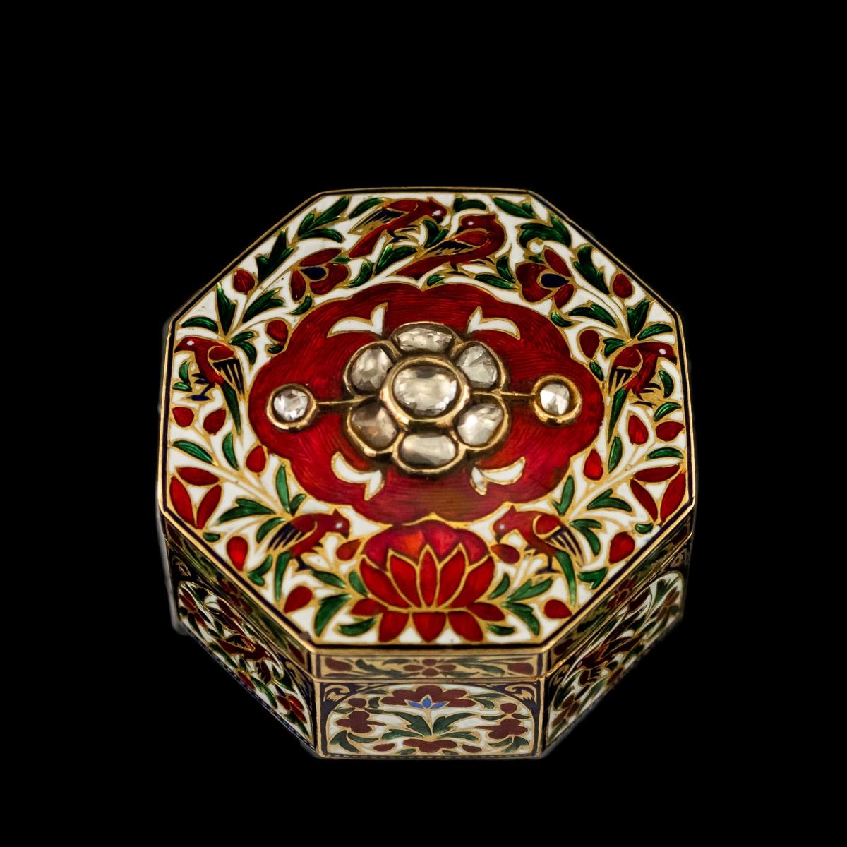 Antique late 19th century Indian gem set, 18-karat gold and enamel box, of octagonal form, the top inset with old cut diamonds in a shape of a flower, the base enamelled with an intricate floral spray and a pair of vibrant blue parakeets in the