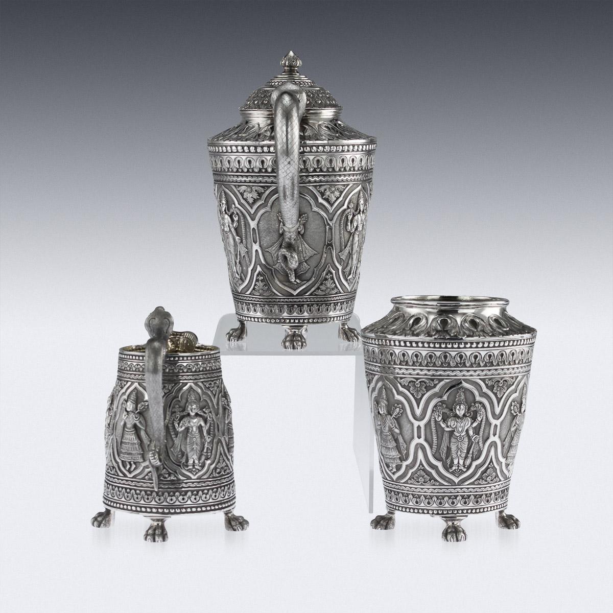 Antique 19th century Indian solid silver tea set, comprising of teapot, sugar bowl and cream jug. Stunning three-piece tea set decorated with stylised Indian deities in oval cartouche reserves, surrounded with Madras style leaf boarders, bead
