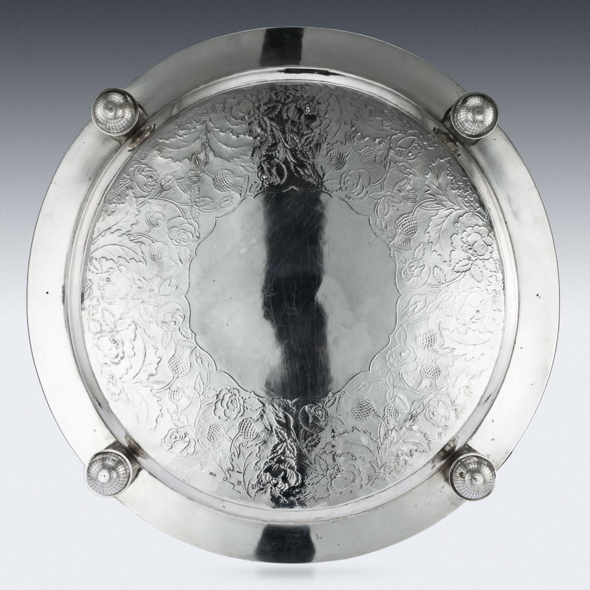 Antique 19th century Scottish solid silver salver with cast border, large size and extremely heavy gauge, of circular form with applied cast fruit and grapevine border, the tray is beautifully engraved with scrolling foliage and thistles on matted