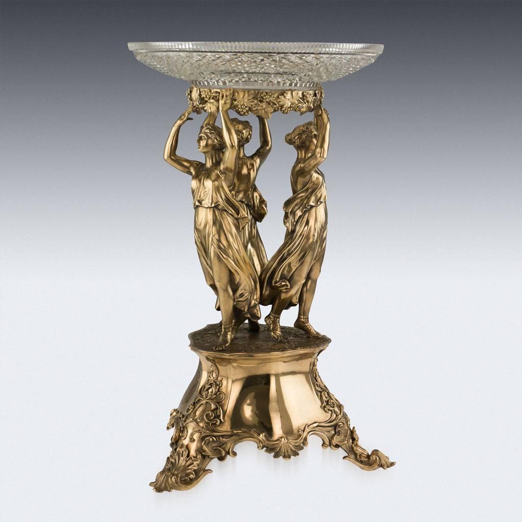 Antique 19th century Victorian solid silver gilt monumental figural centrepiece, raised on three cast foliate feet, the base is applied with a very crisp scrolling floral decoration, supporting three large and finely modelled classical female