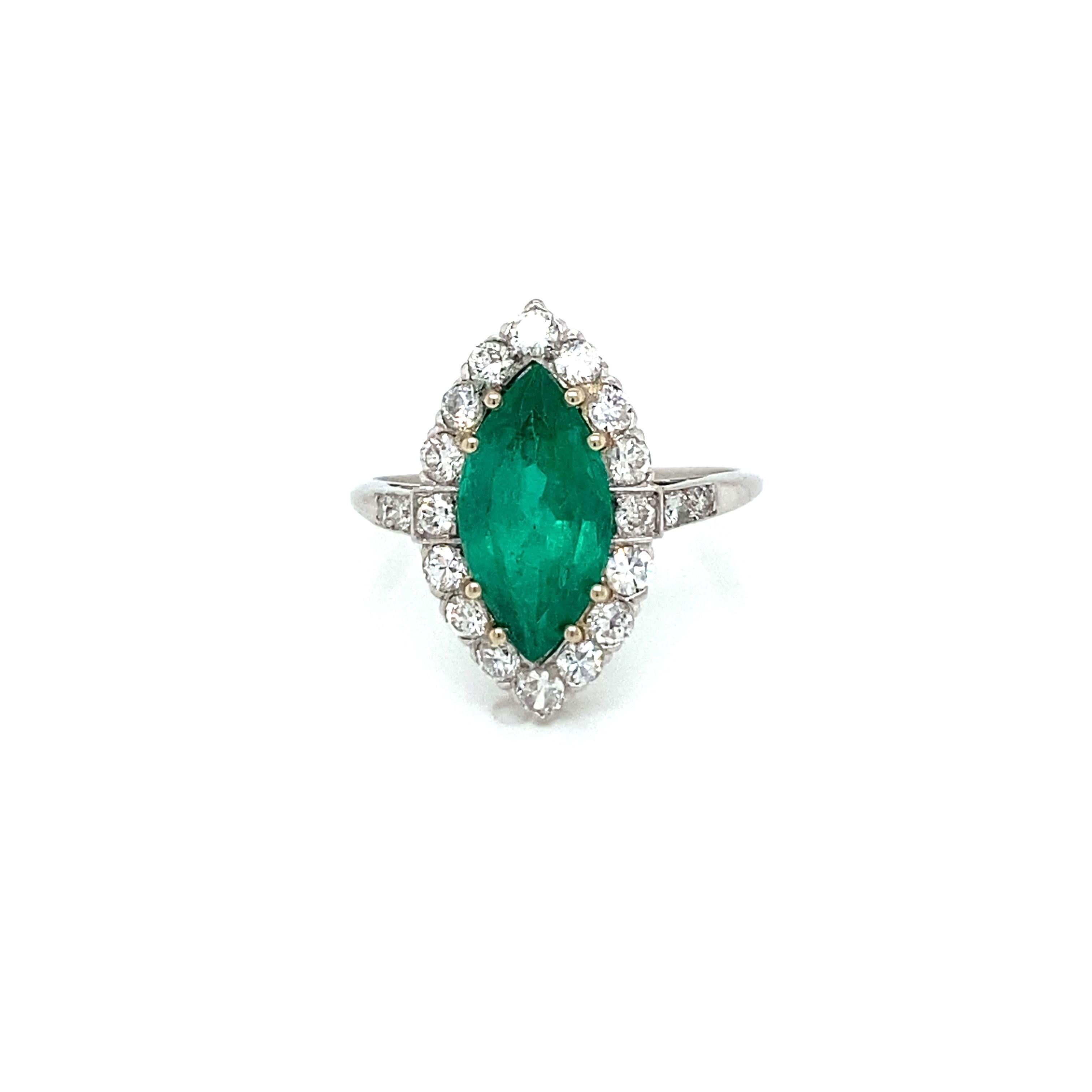 Beautiful Handcrafted Platinum Gold Zambian Emerald and Diamond Engagement ring. 
The cluster style ring is centered with 2.10 carat Marquise Vivid green Natural Emerald, accented by 20 Old mine cut diamonds weighing approx. 0,30 carats total. and