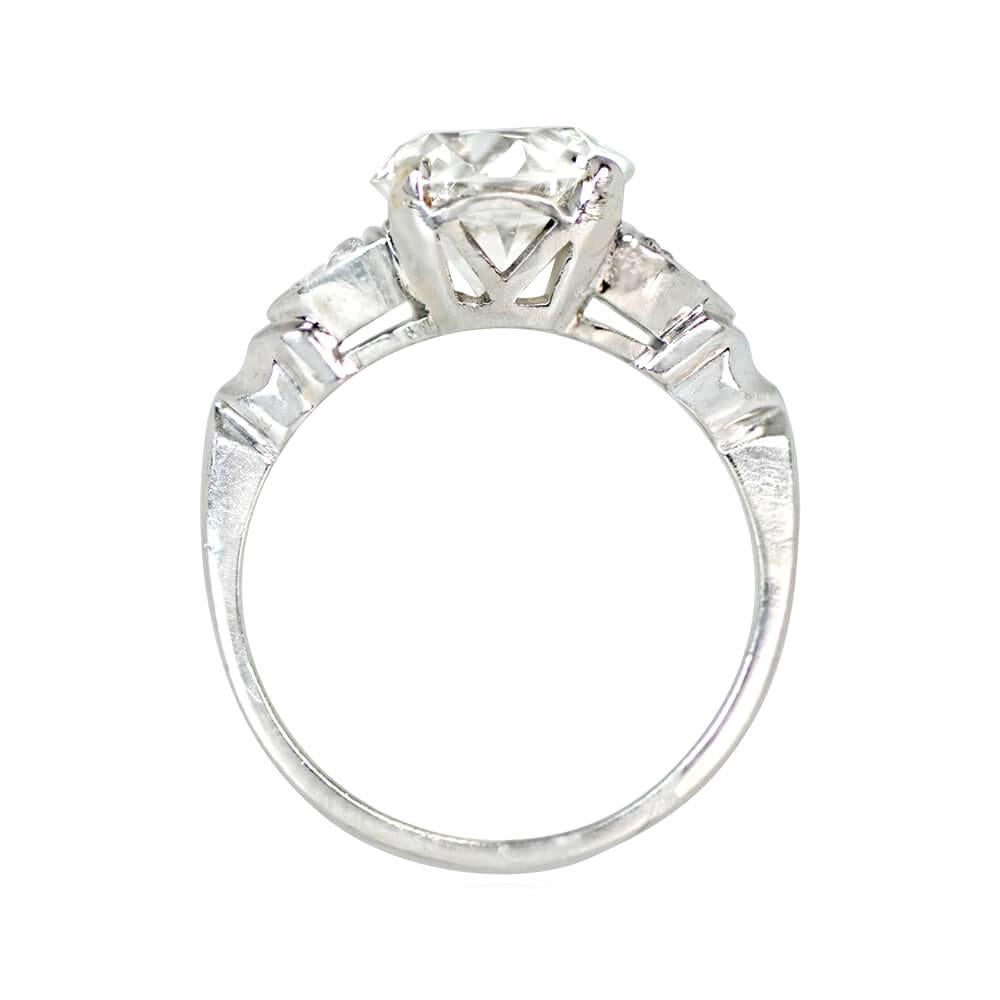 Antique Art Deco engagement ring showcases a 2.02 carat old European cut diamond (J color, VS1 clarity) in prong setting. The platinum band features smaller diamonds pave-set inside triangular bezels on each shoulder, decorated with fine milgrain.