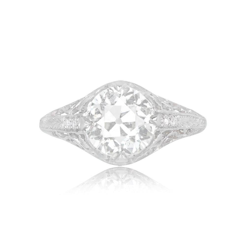 Elegant Art Deco antique engagement ring crafted in platinum circa 1925. Highlighted by a 2.04ct old European cut diamond (K color, SI1 clarity) in prongs. Intricate hand engraving and open filigree work enhance its beauty.

Ring Size: 6.5 US,