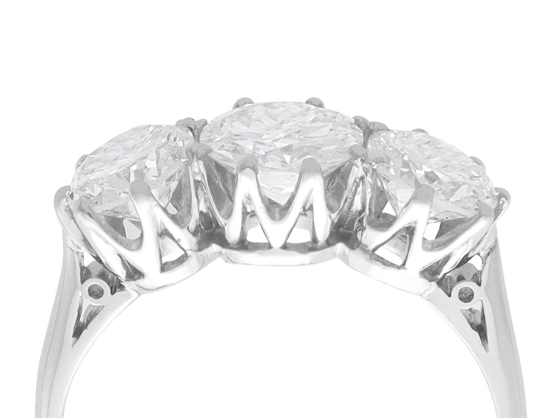 A stunning, fine and impressive 2.05 carat diamond and platinum trilogy ring; part of our diverse engagement ring collections.

This stunning 1930s platinum trilogy diamond ring has been crafted in platinum.

The pierced decorated setting is