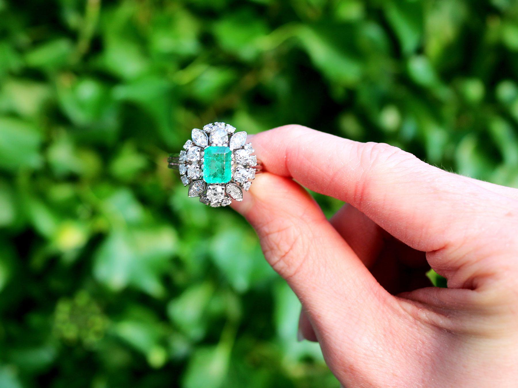 A stunning, fine and impressive antique 2.05 carat emerald and 1.99 carat diamond, platinum dress ring; part of our diverse antique jewelry collections.

This stunning, fine and impressive emerald and diamond cluster ring has been crafted in