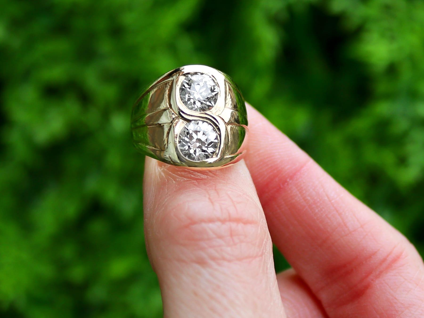 A stunning, fine and impressive antique 1920's 2.07 carat diamond and 14 karat yellow gold ring; part of our diverse men's jewelry collection.

This stunning, fine and impressive antique diamond ring has been crafted in 14k yellow gold.

The