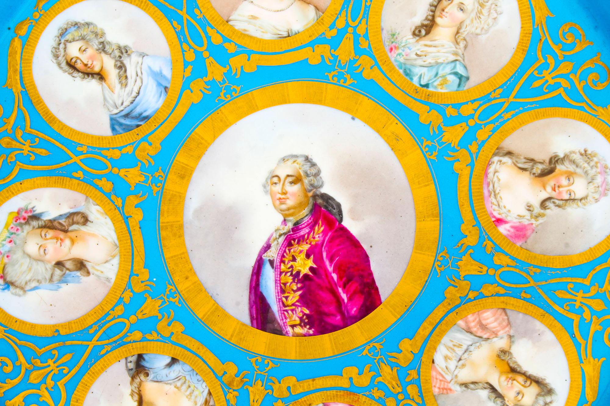 This is an important large decorative antique French ormolu-mounted Sevres porcelain charger featuring portaits of Louis XVI and important members of his court, the rear with Sevres mark for 1790.
 
It has a striking Bleu Celeste and gilt tooled